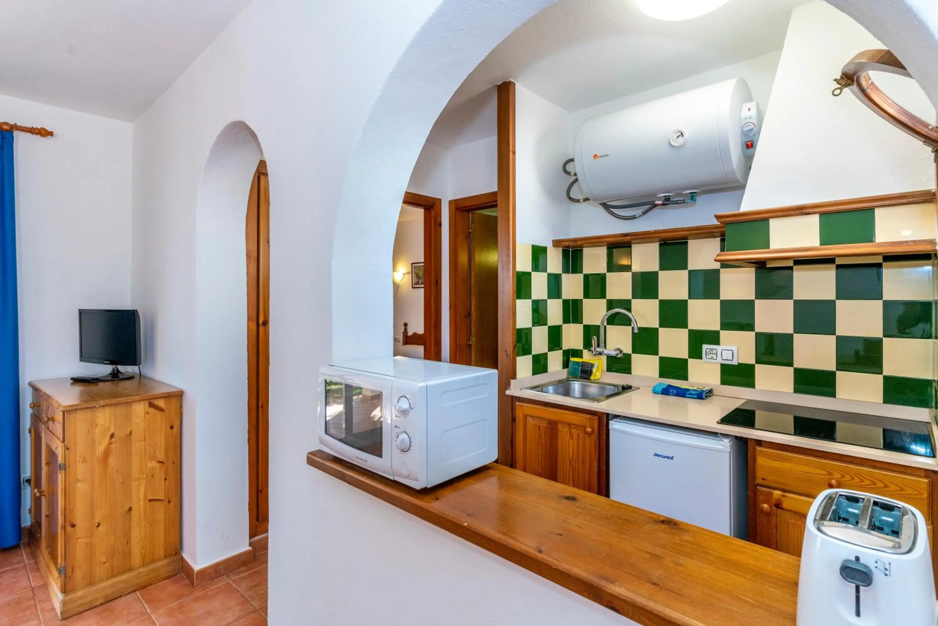 Kitchen or kitchenette in Apartamentos Vistapicas