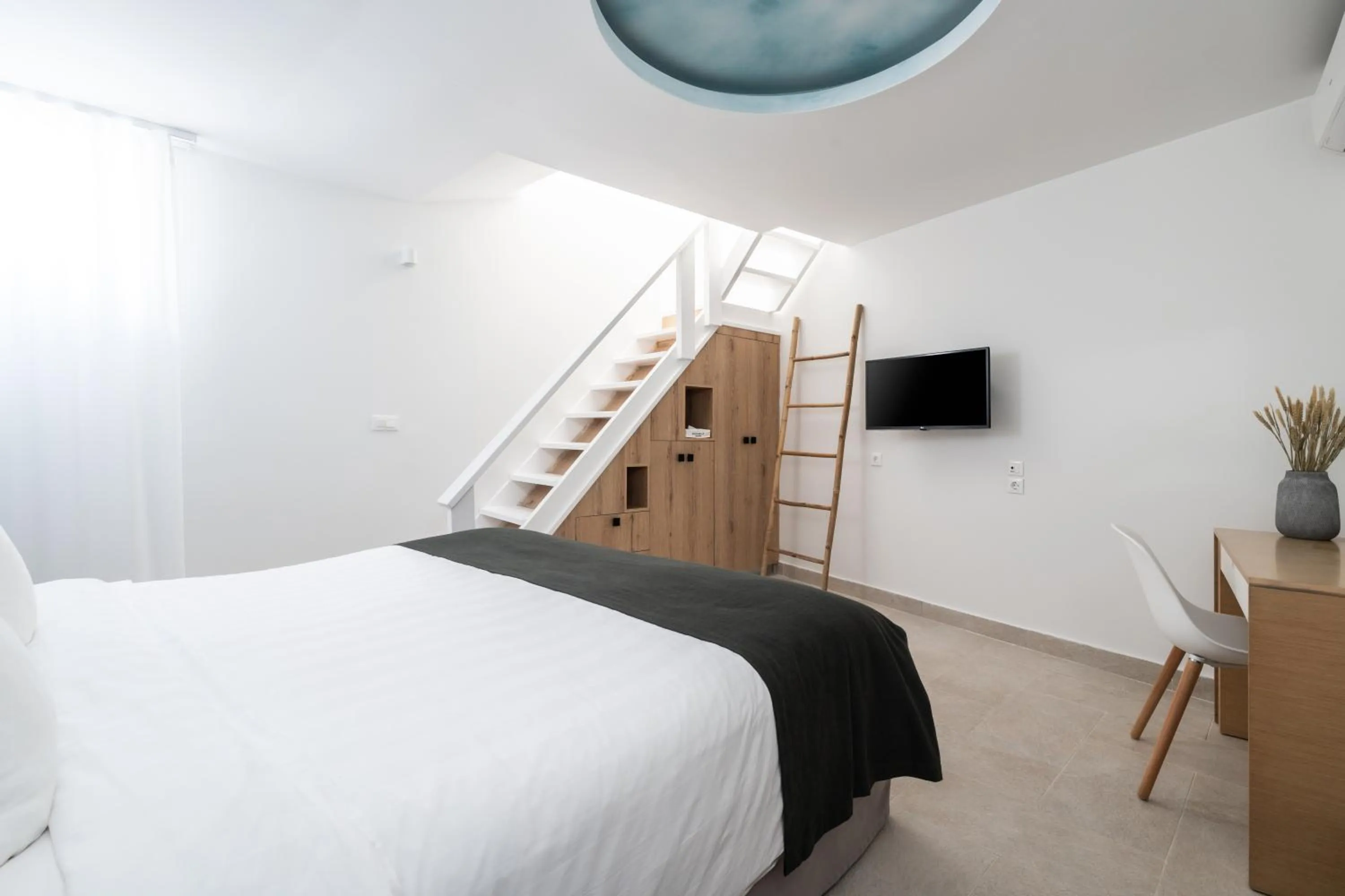 Bed in Rocabella Santorini Hotel & Spa