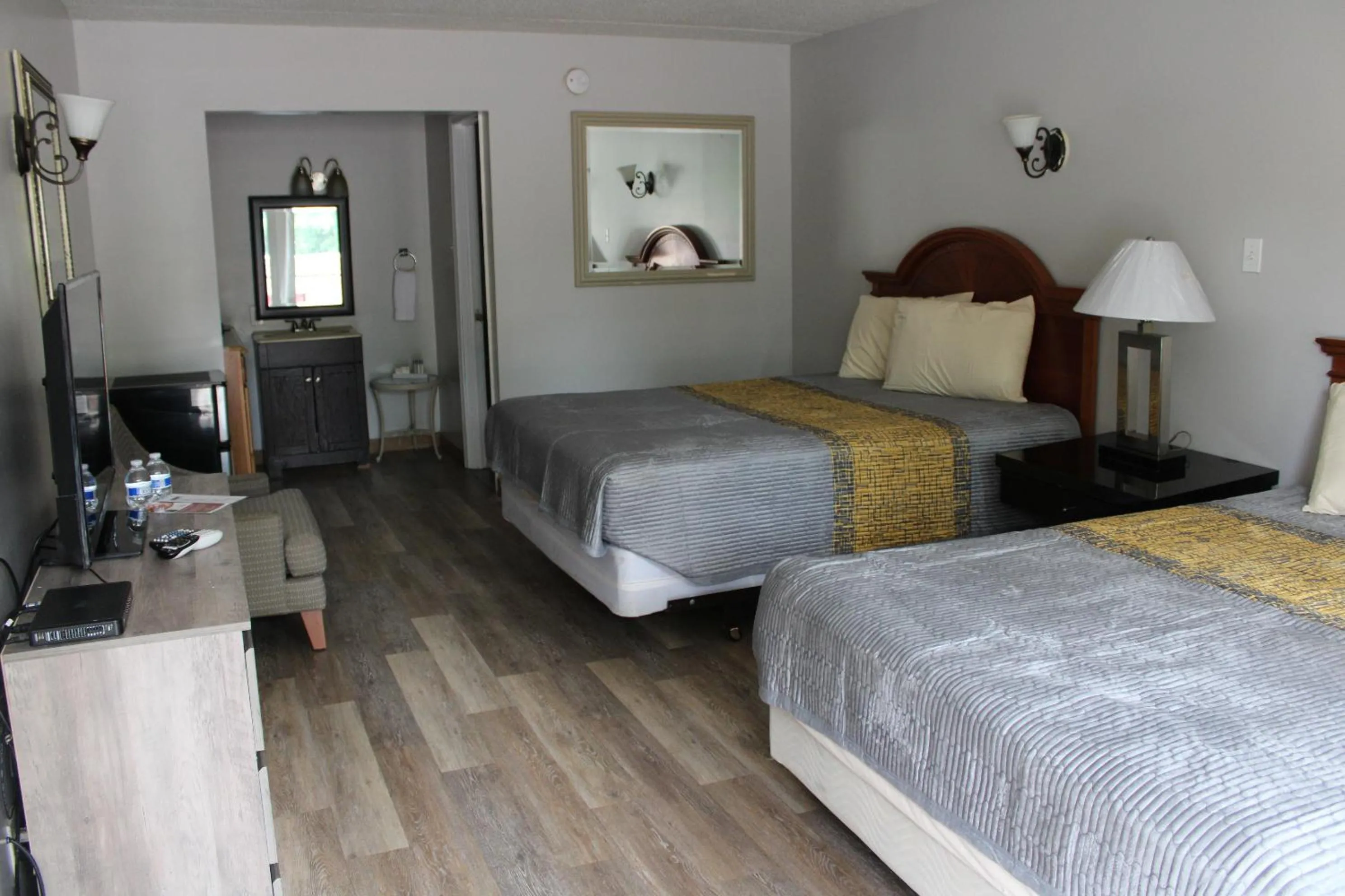 Bed in ANS INN & SUITES