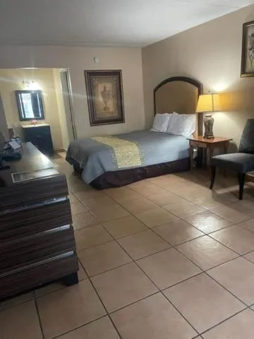 Bed in ANS INN & SUITES