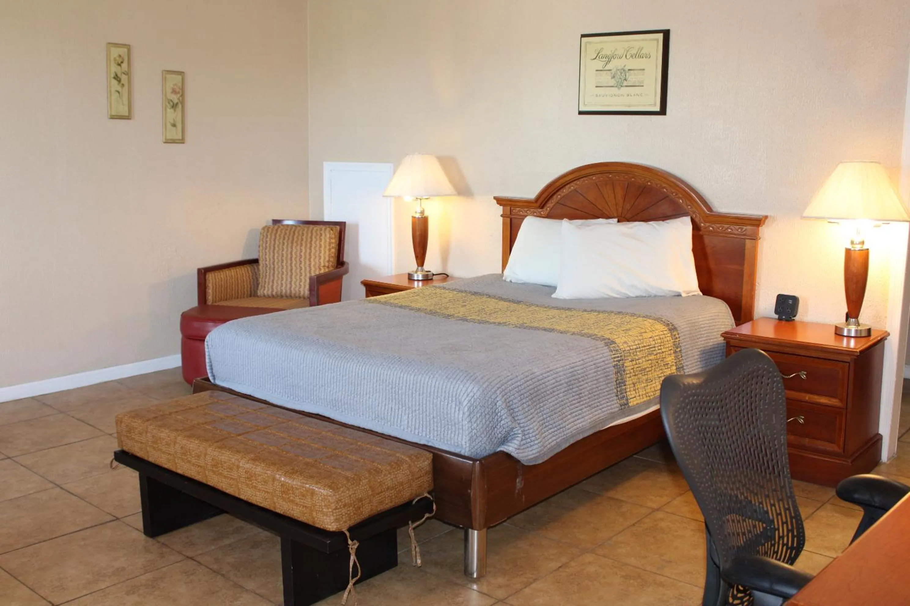 Bed in ANS INN & SUITES