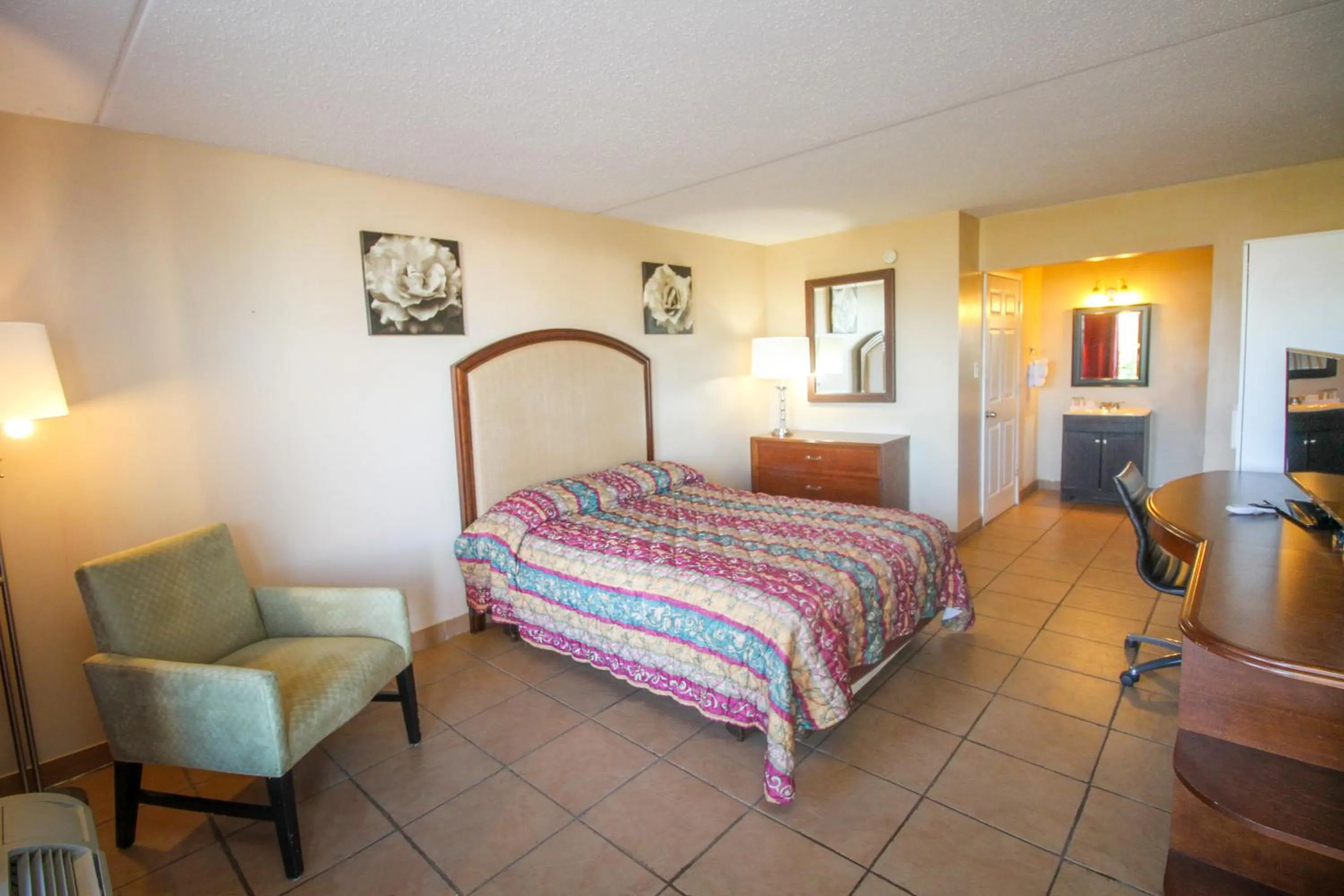 Bed in ANS INN & SUITES