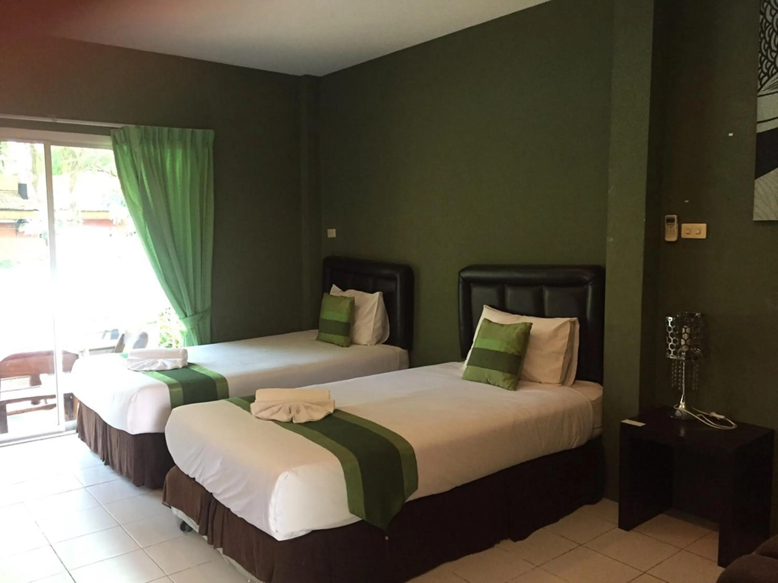 Bed in Aurora Resort Kanchanaburi