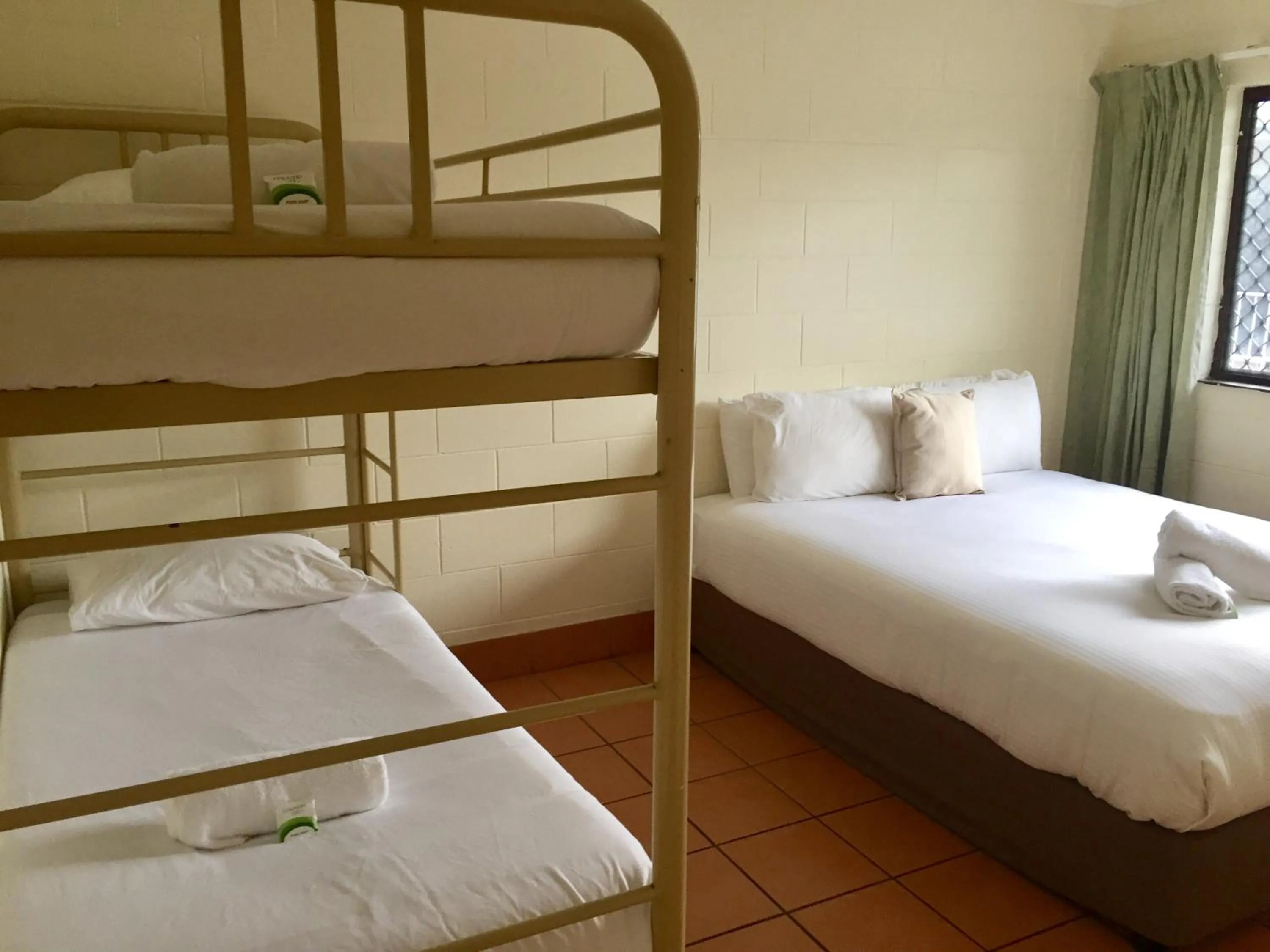 Bed in Koala Beach Resort Cairns