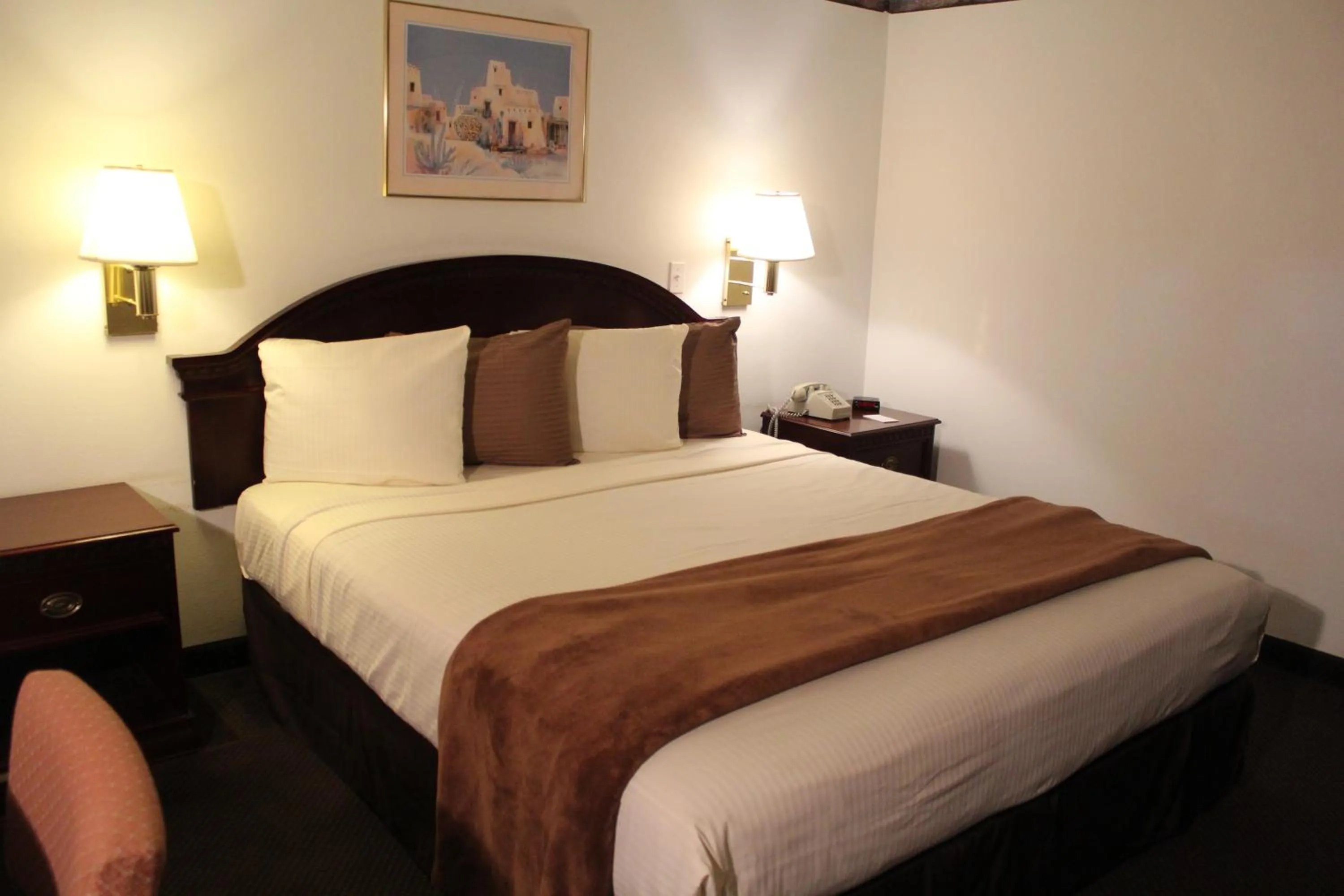 Bed in Dodge House Hotel