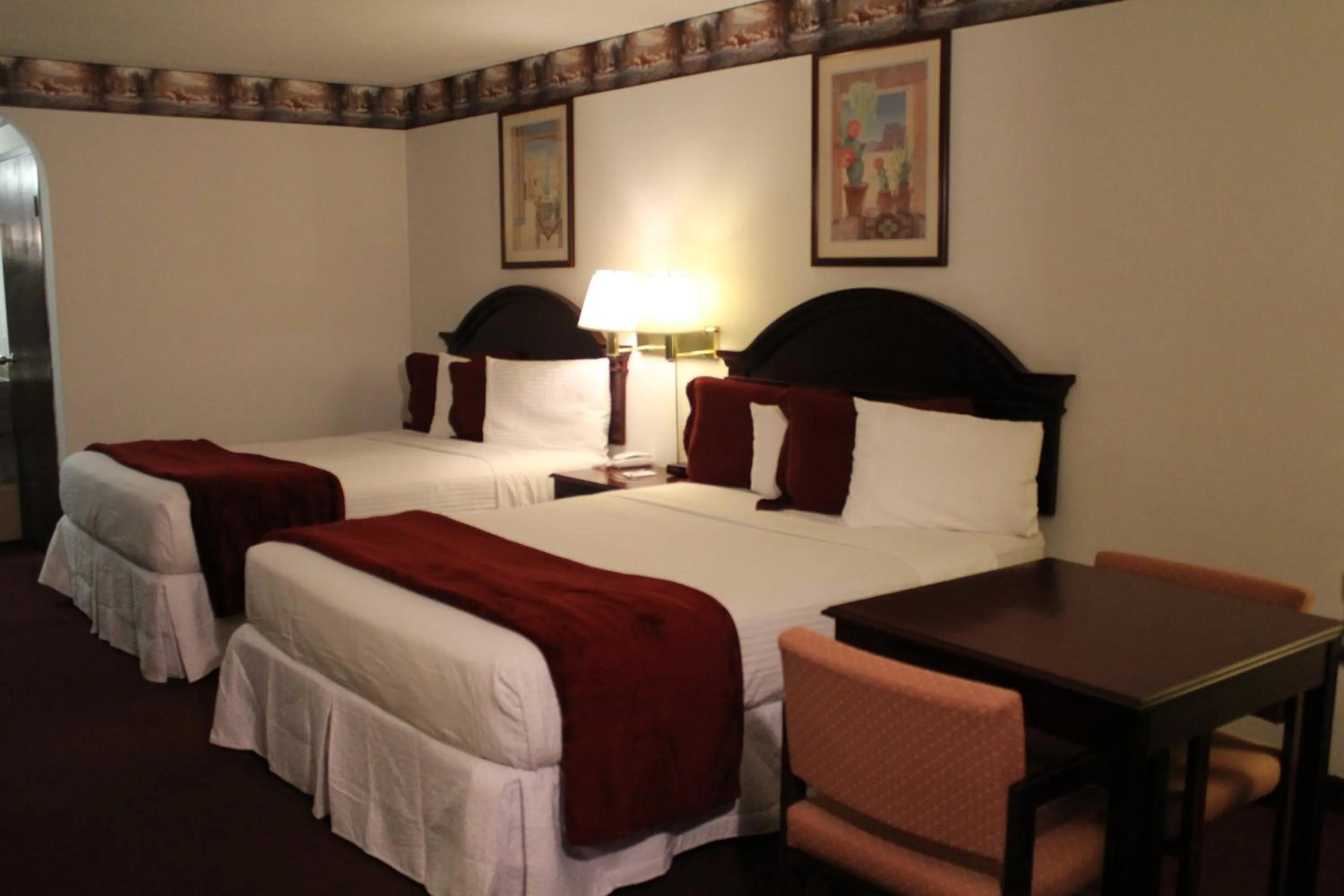 Bed in Dodge House Hotel