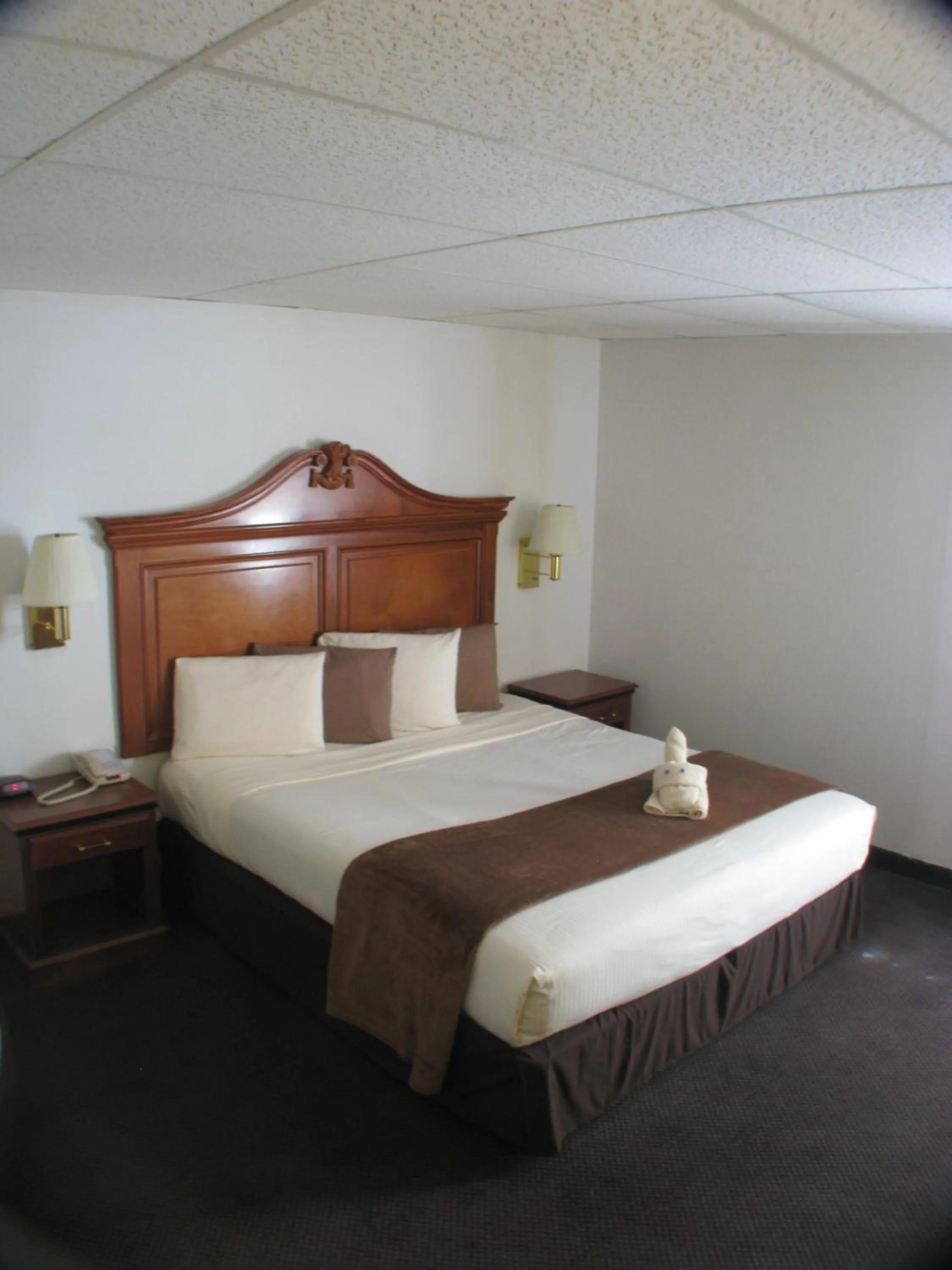 Bed in Dodge House Hotel