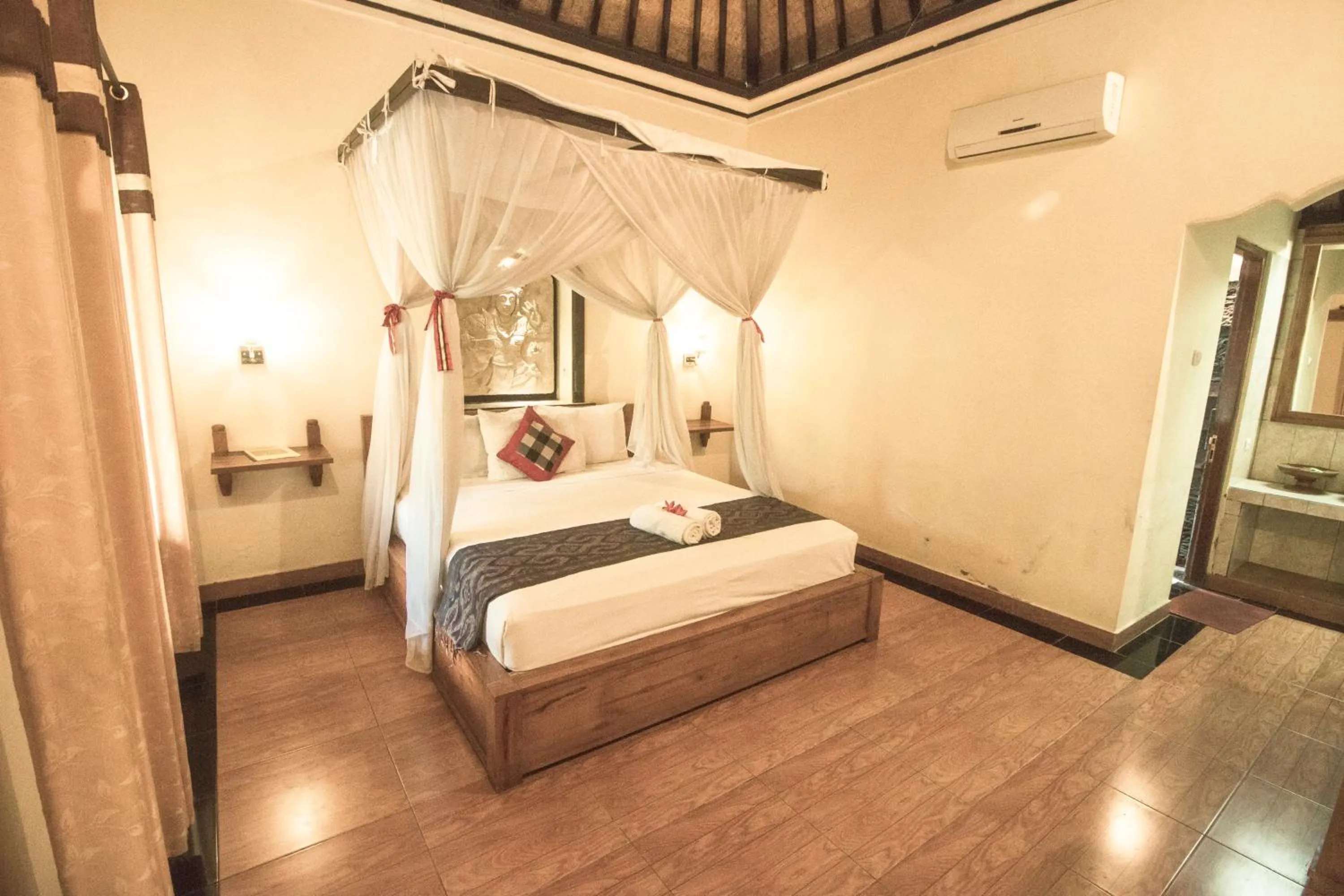 Bed in Trijaya Guest House Pemuteran