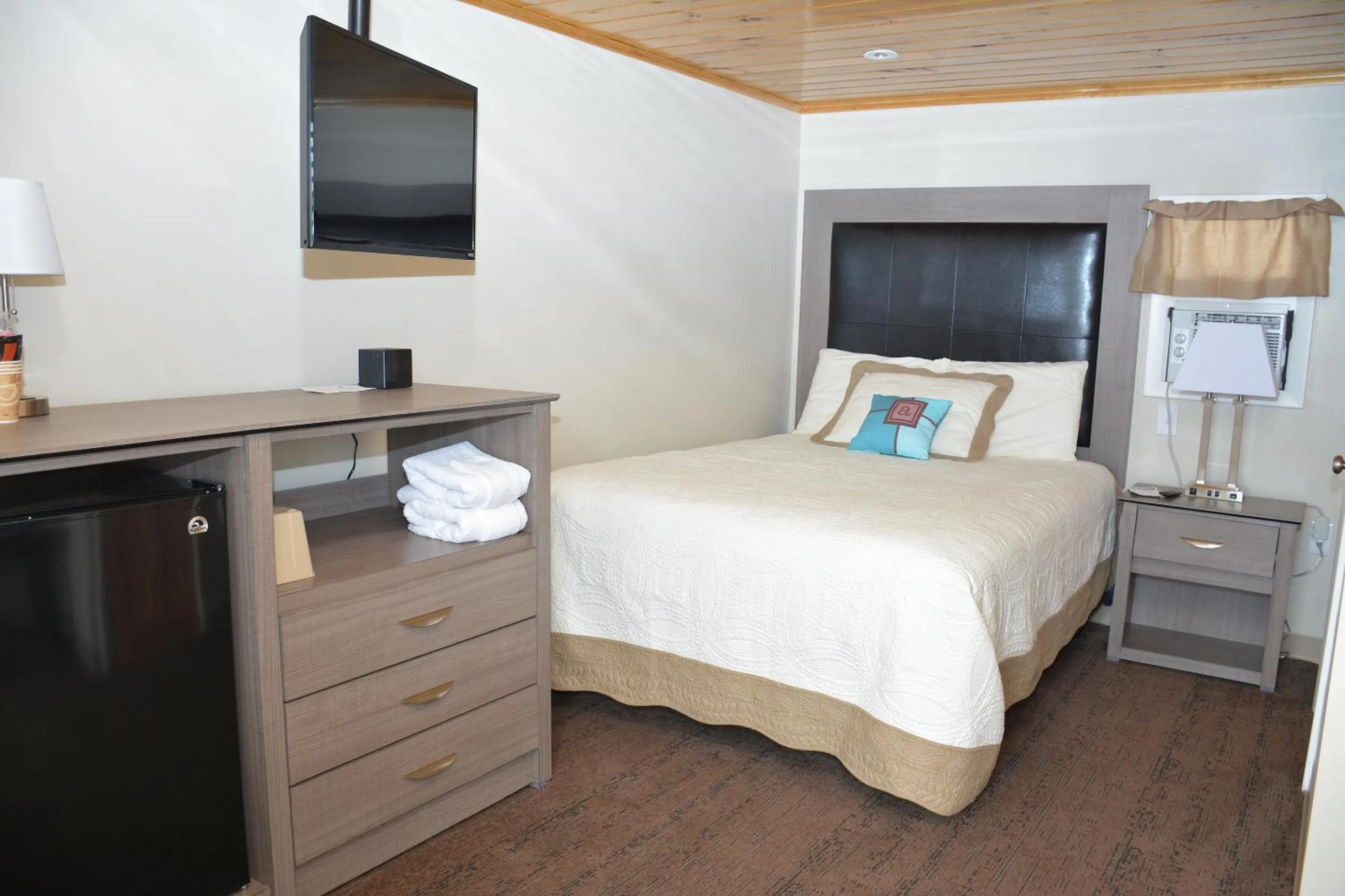 Bed in Alouette Beach Resort Economy Rooms