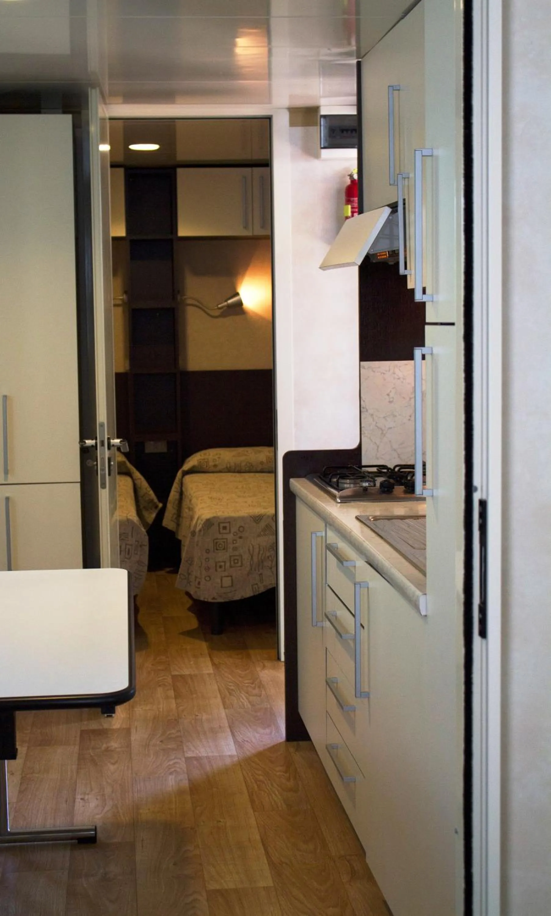 Kitchen or kitchenette, Bed in Camping La Focetta Sicula