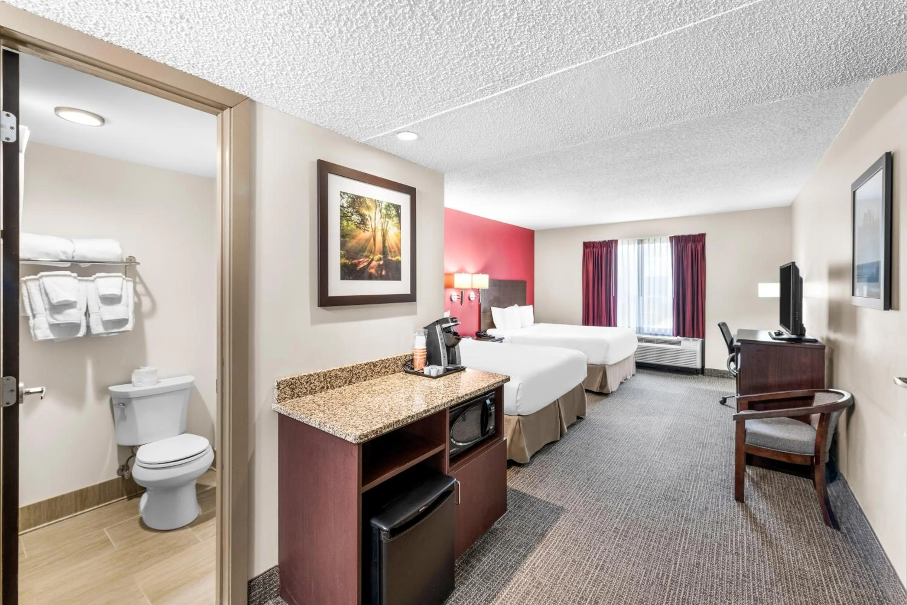 Bed in Ramada by Wyndham Columbus Hotel & Conference Center