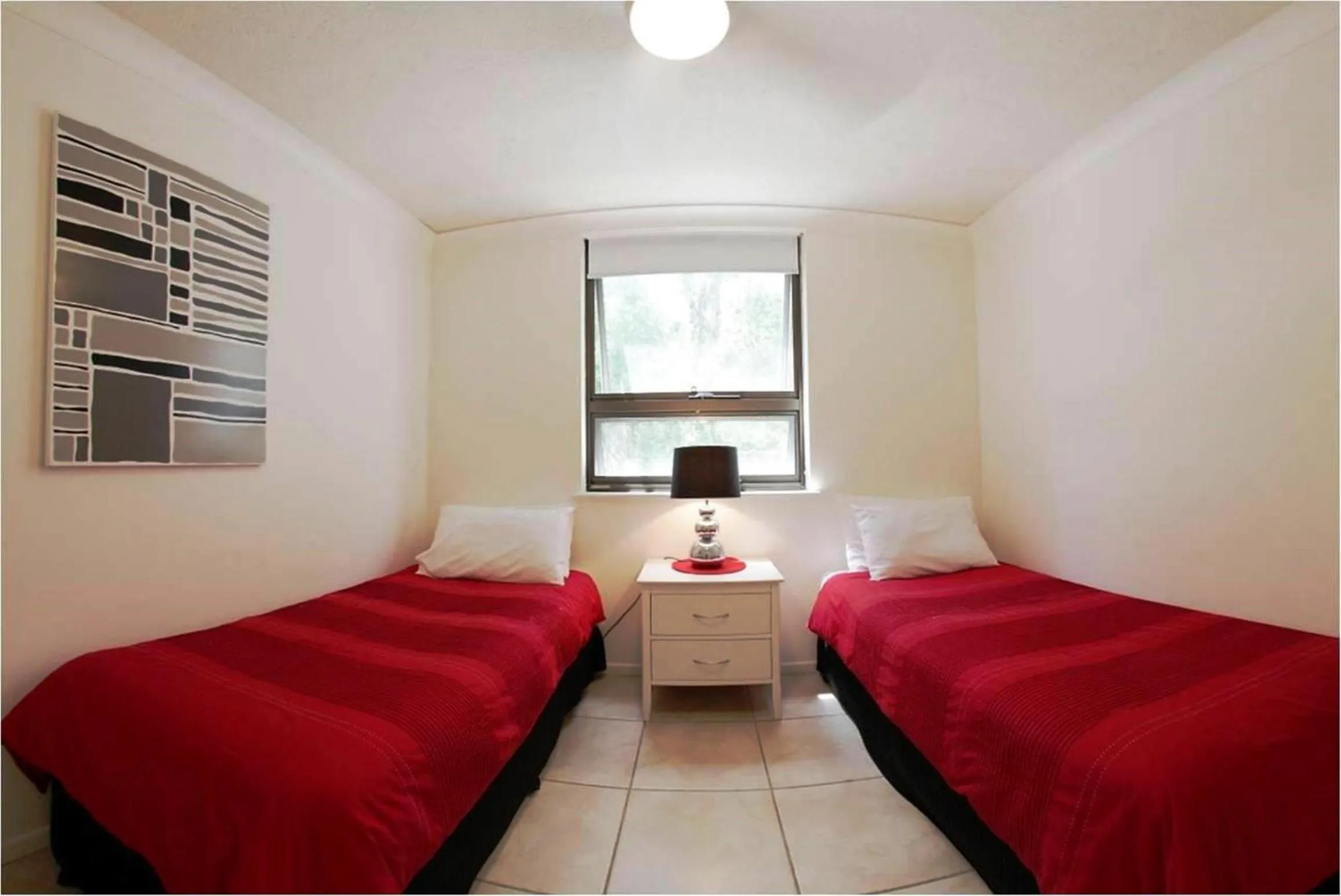 Bed in Headland Tropicana Resort