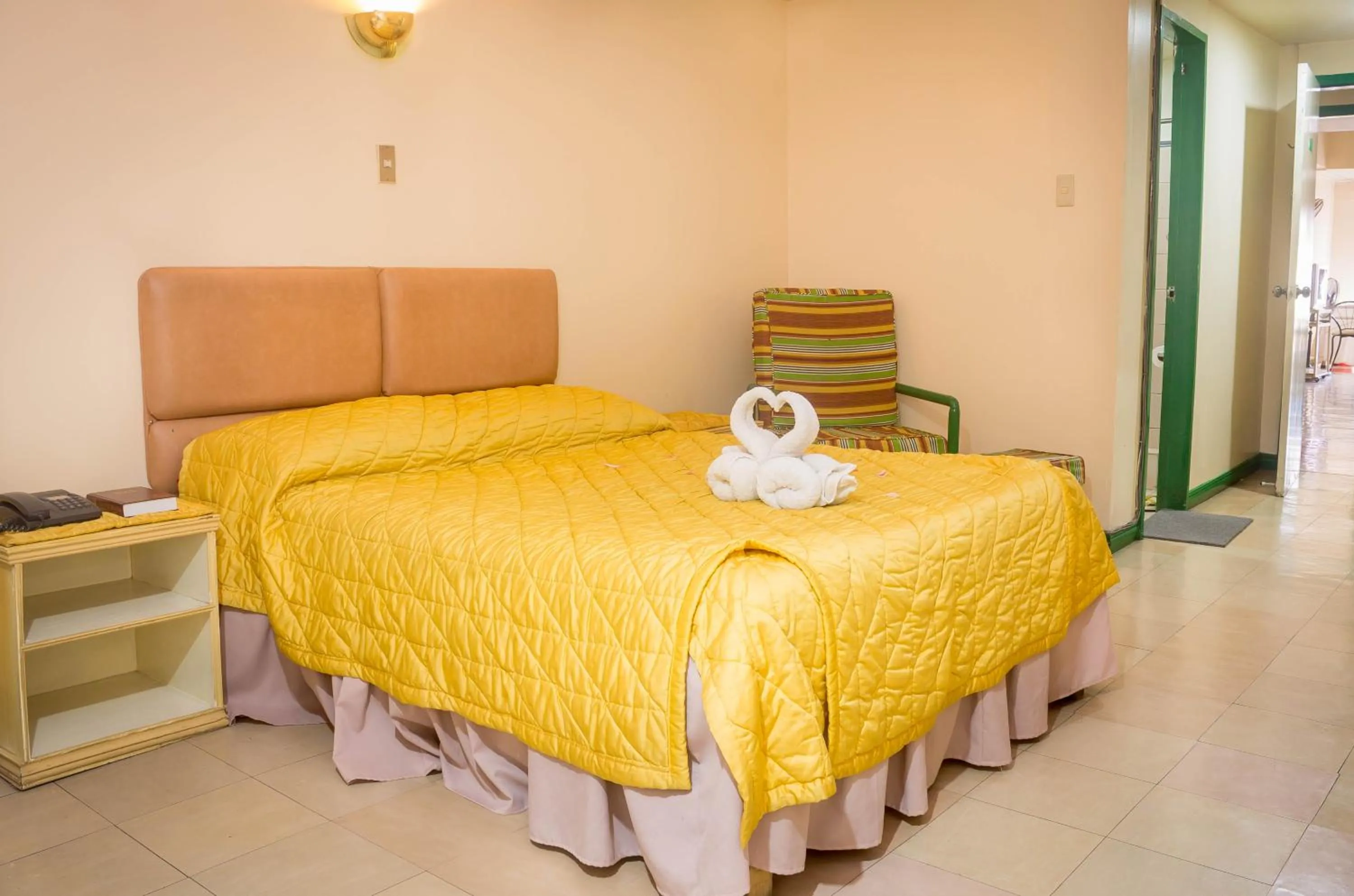 Facade/entrance, Bed in Benguet Prime Hotel