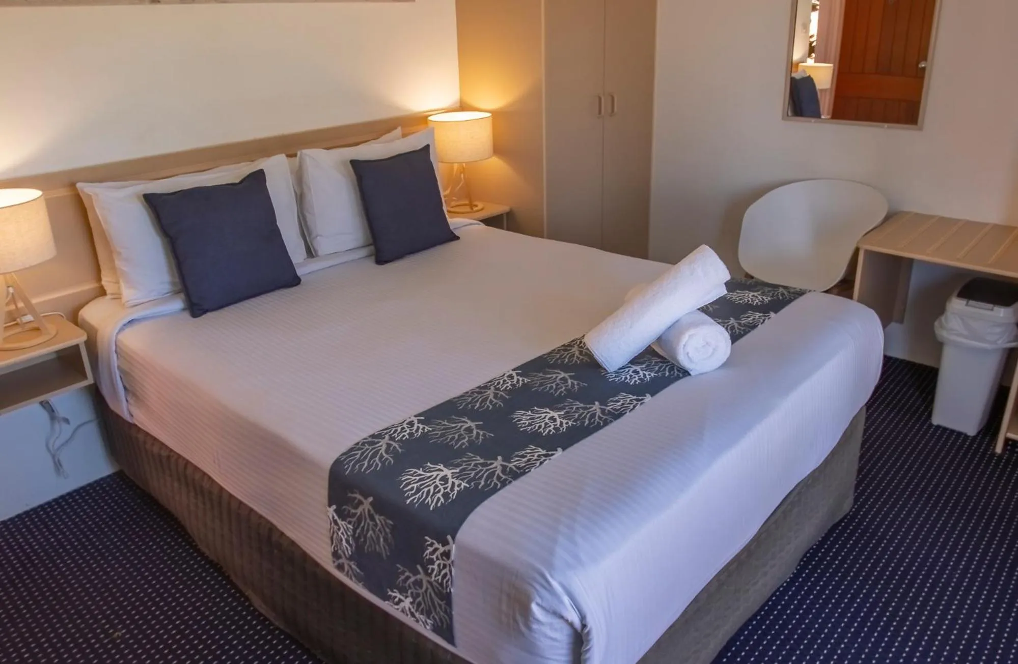 Bed in OCEAN BREEZE MOTEL