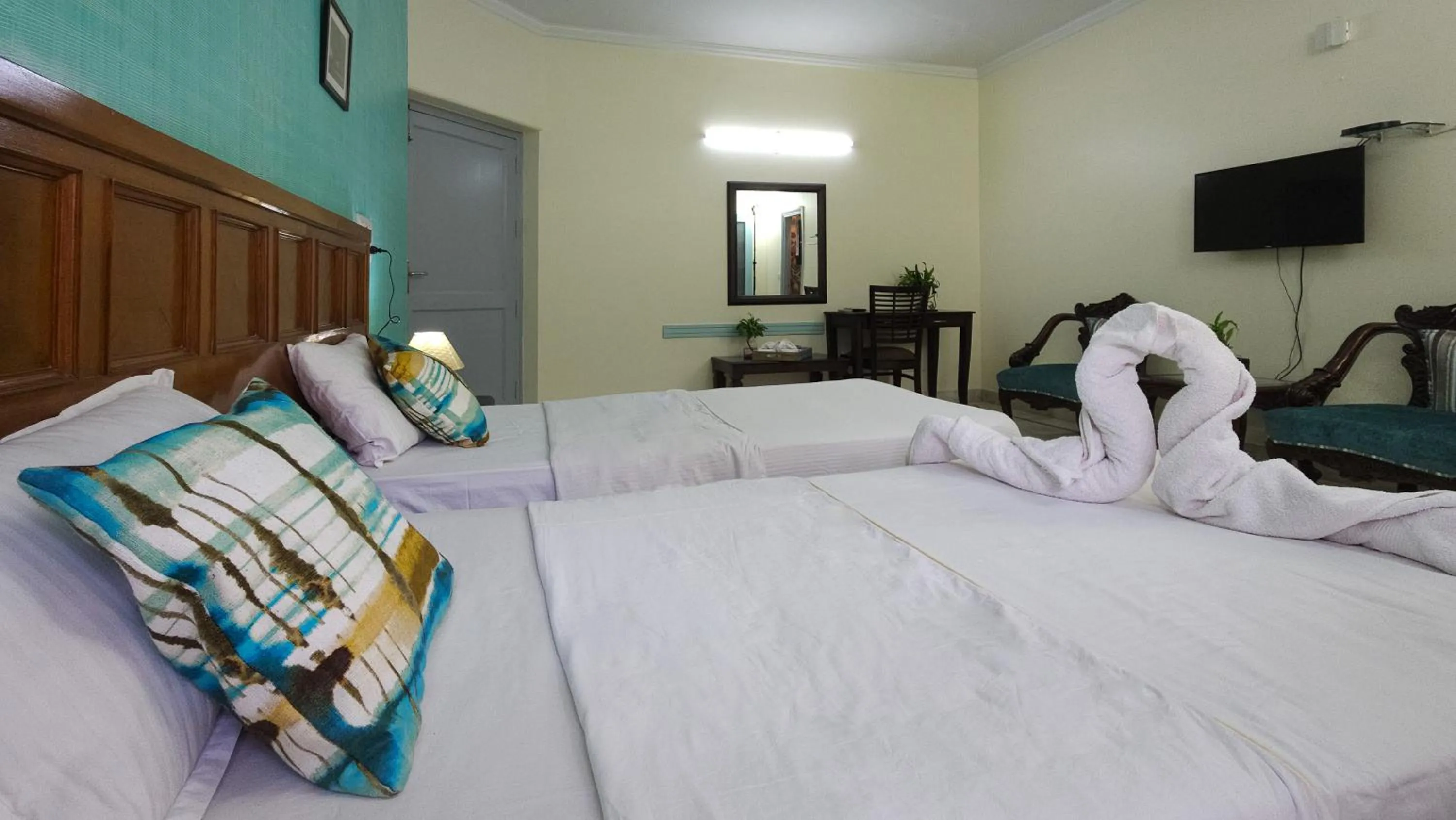 Bed in Prakash Kutir B&B