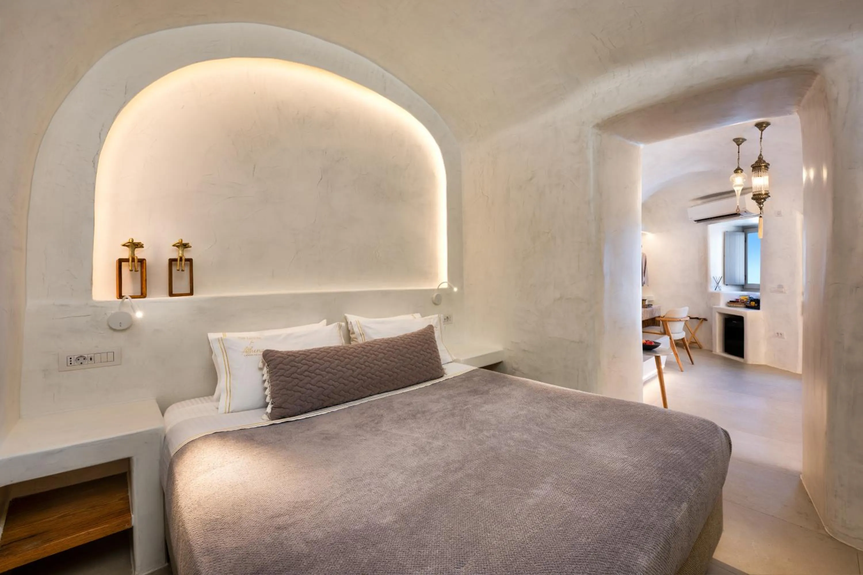 Bed in Athina Luxury Suites