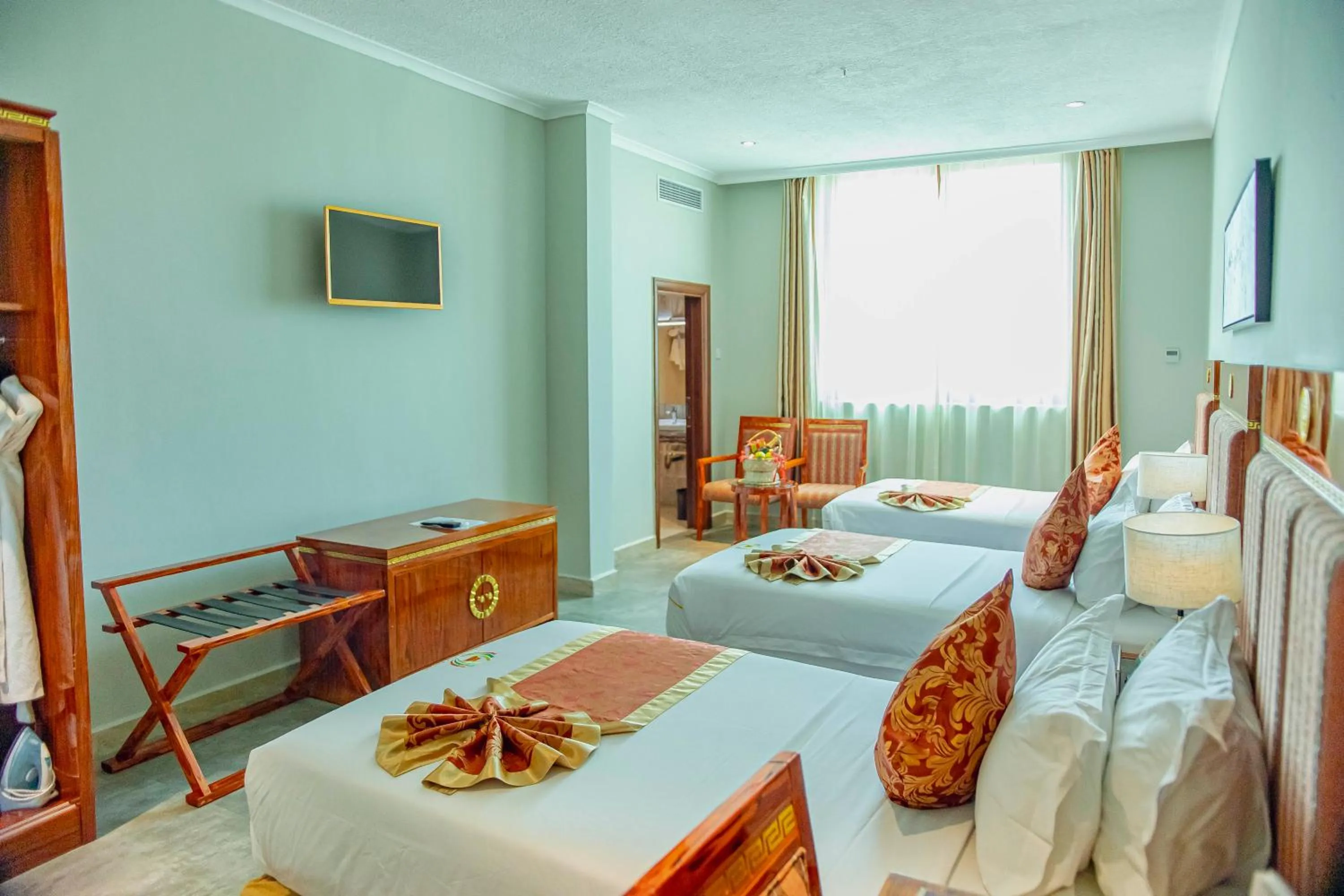 Photo of the whole room, Bed in Tiffany Diamond Hotels LTD - Makunganya