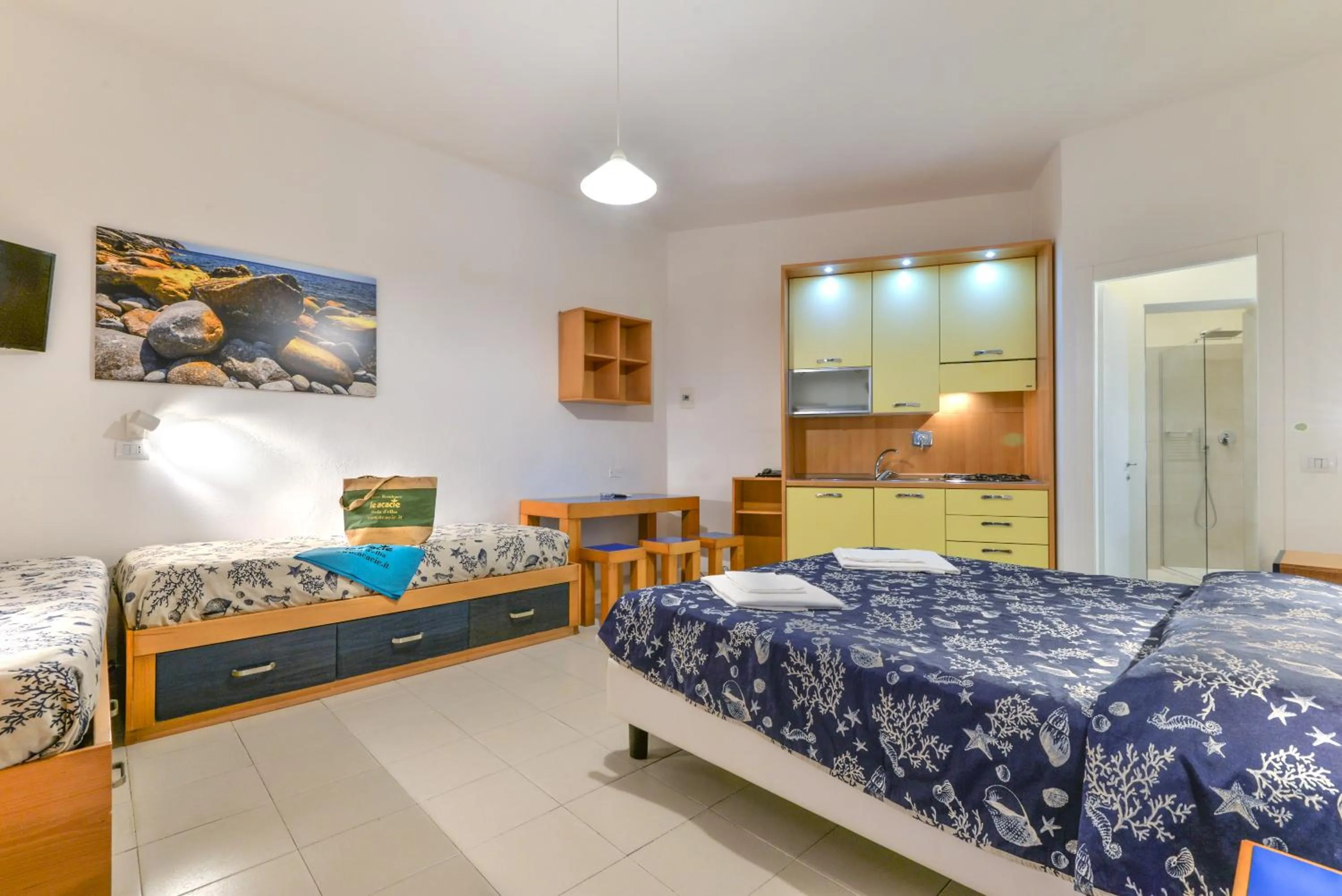 Living room, Bed in Residence Le Acacie