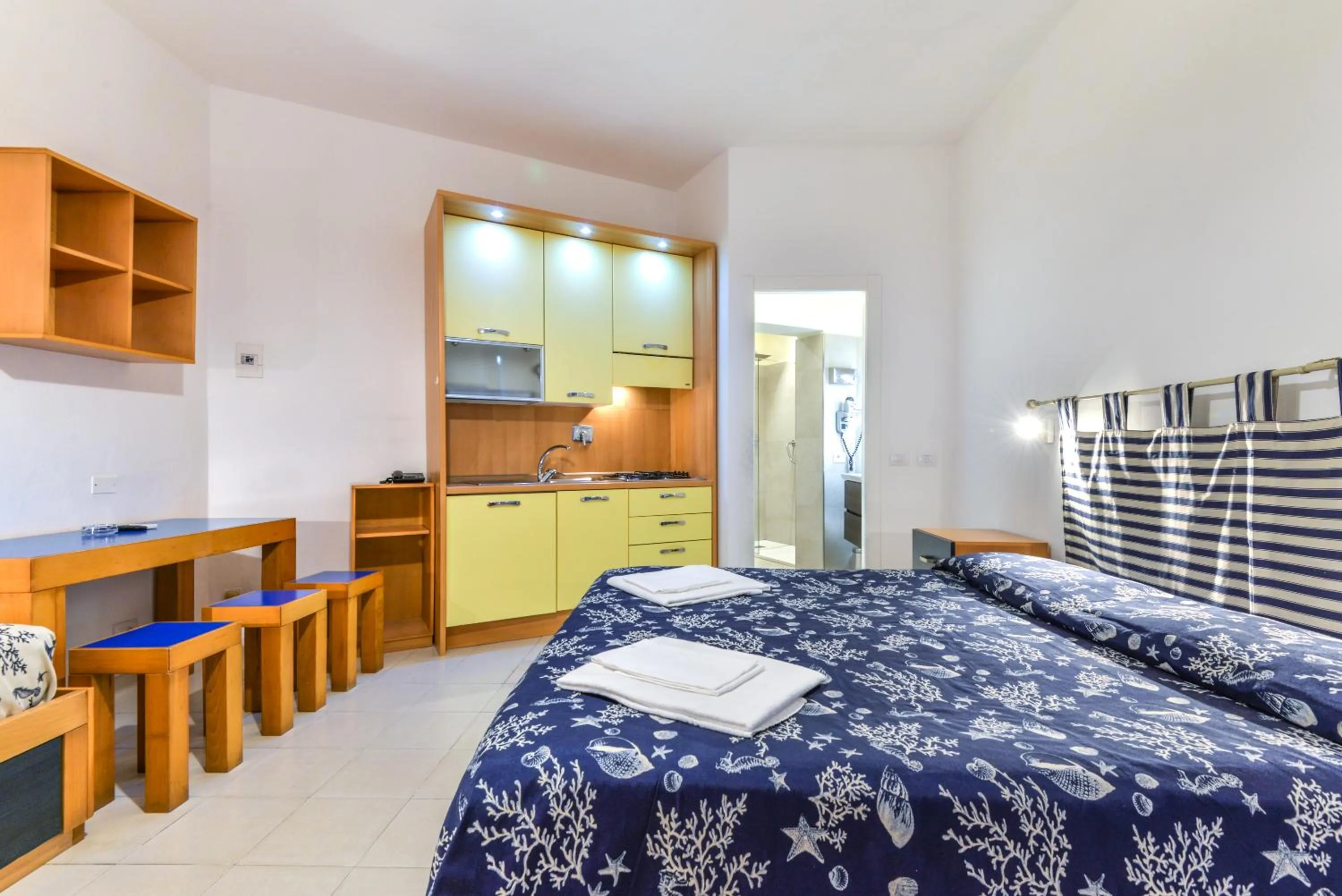 Living room, Bed in Residence Le Acacie