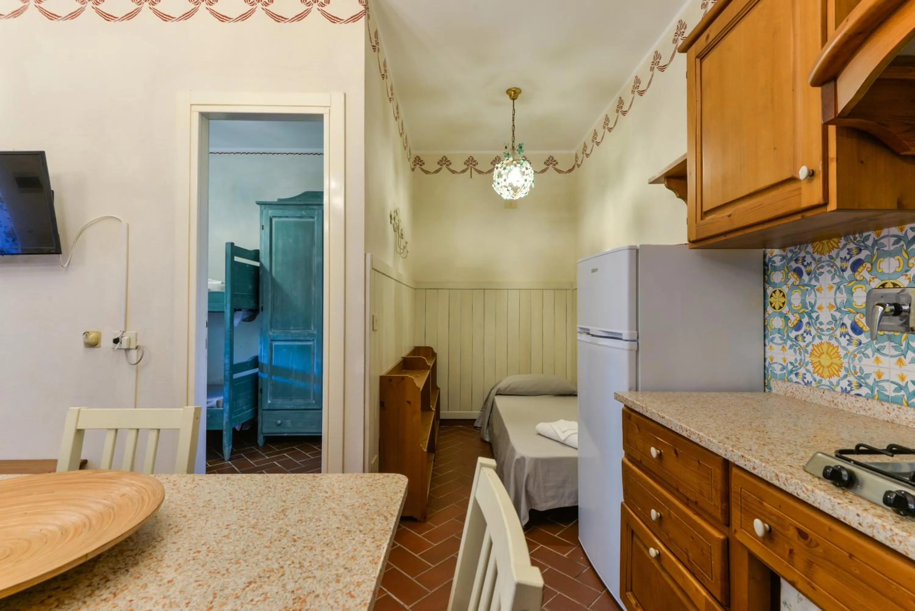 Living room, Bed in Residence Le Acacie