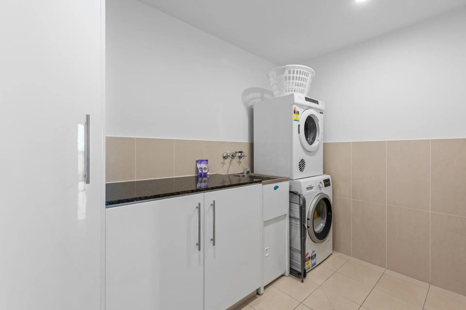 washing machine in Proximity Waterfront Apartments