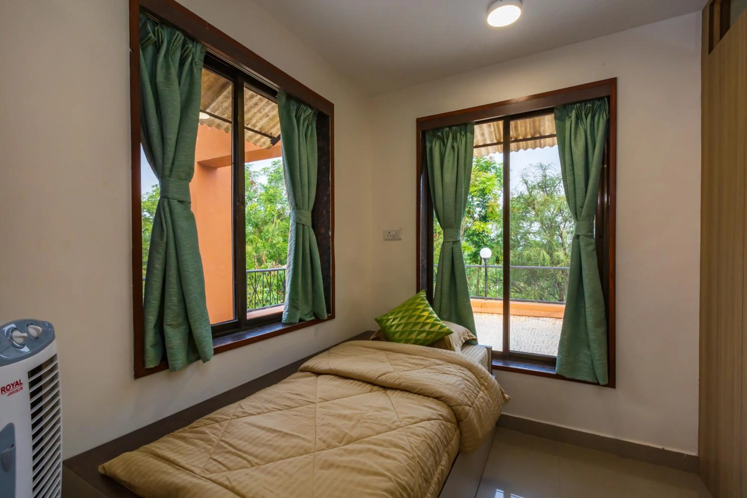 Bed in SaffronStays Ekaant- 3BR pet-friendly pool villa with lawn, games & river walk in gated community near Mumbai