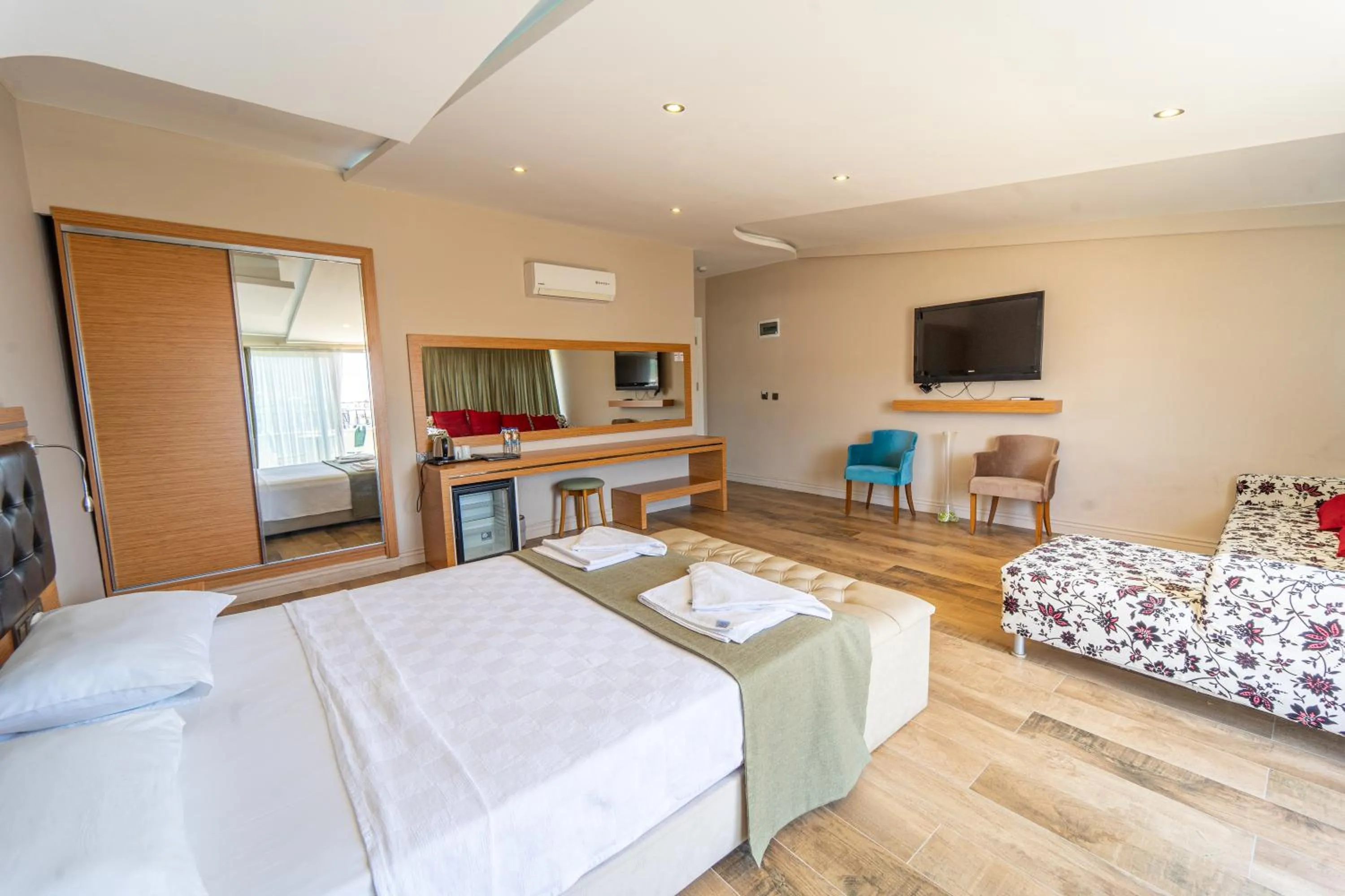 Bed in Aurasia Sea Side Hotel