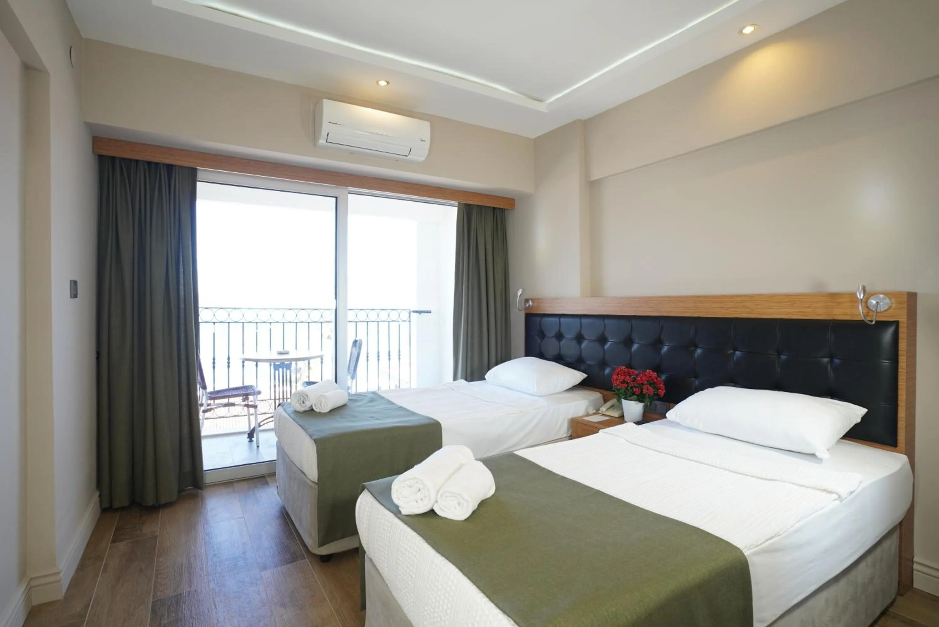 Bed in Aurasia Sea Side Hotel