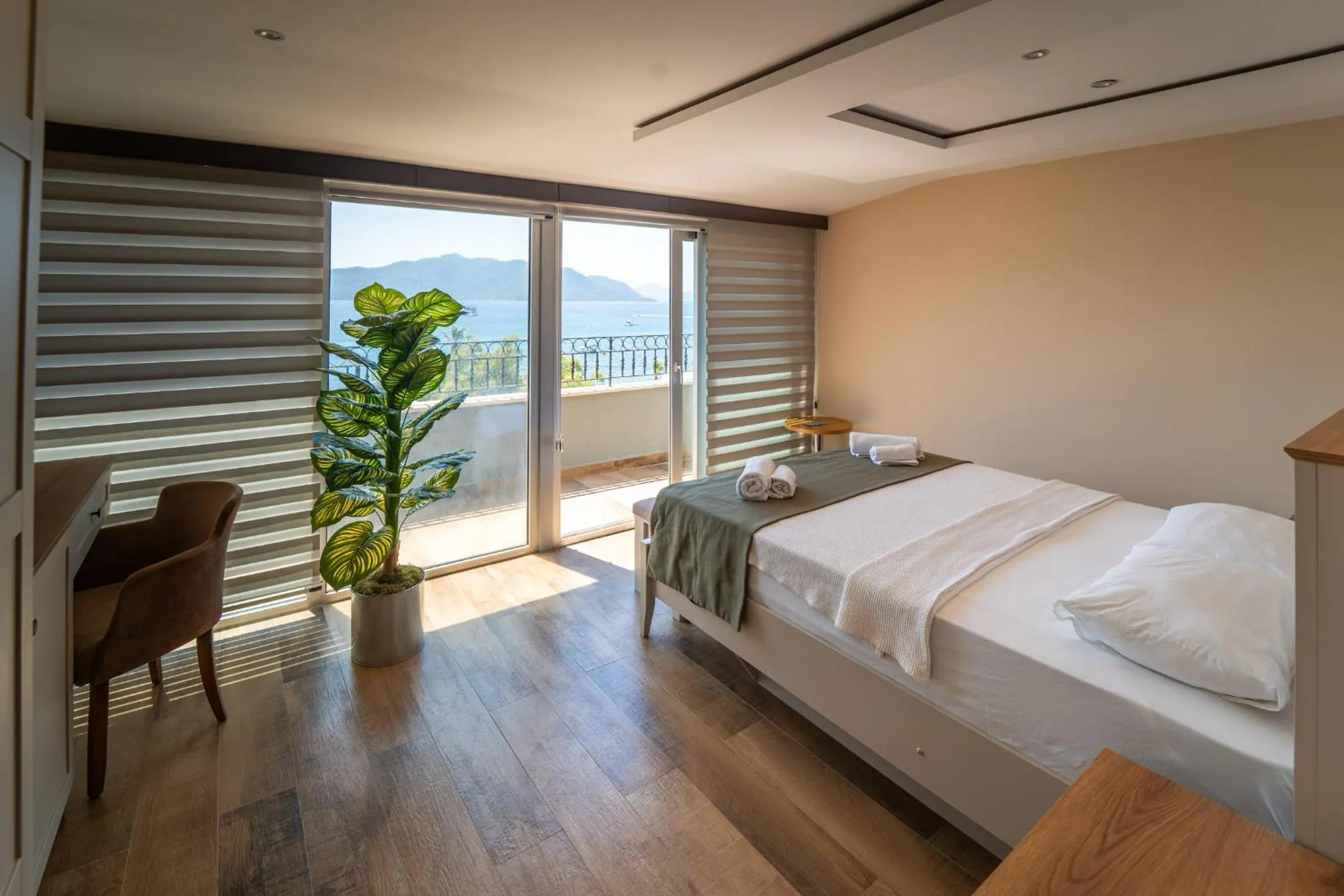 Bed in Aurasia Sea Side Hotel