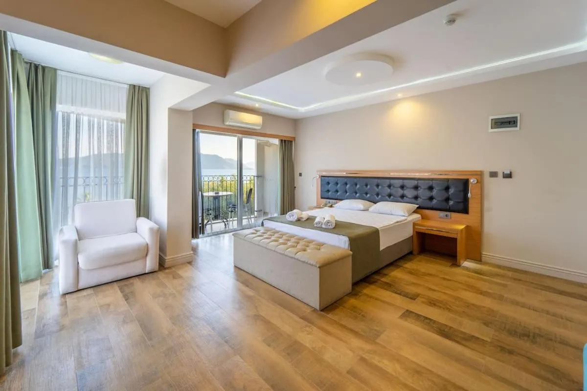 Bed in Aurasia Sea Side Hotel