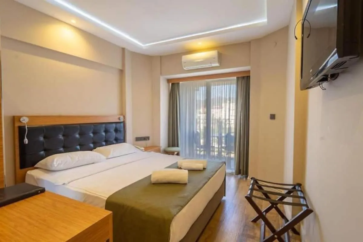 Bed in Aurasia Sea Side Hotel