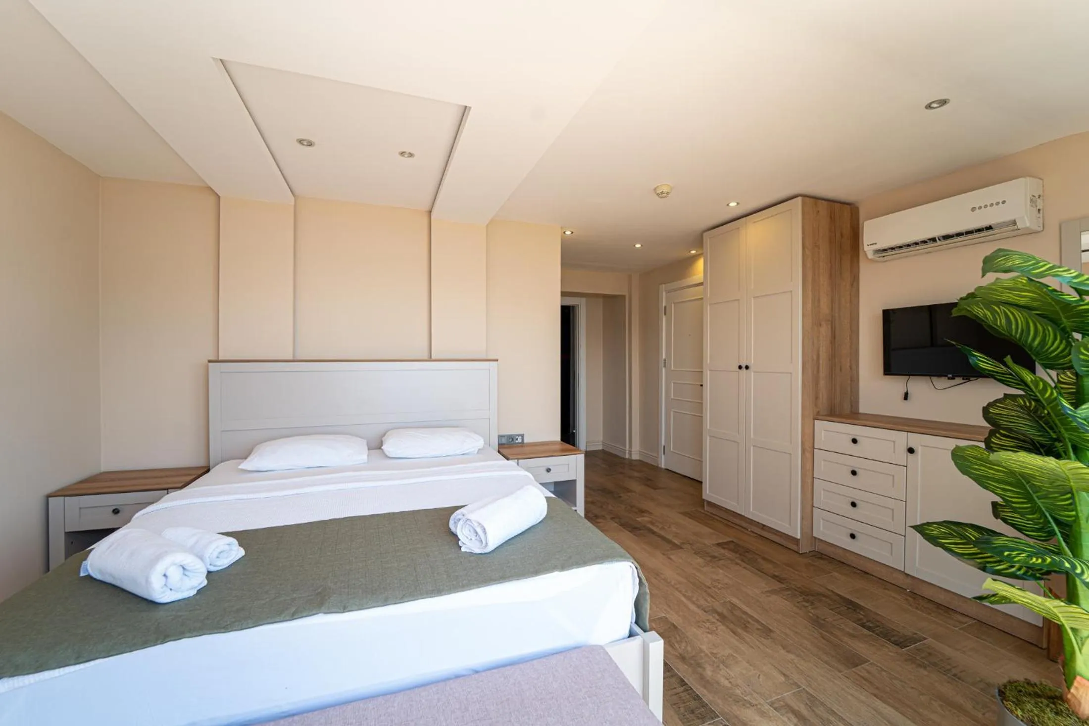 Bed in Aurasia Sea Side Hotel