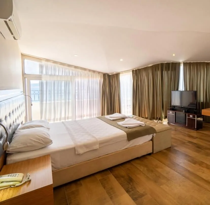 Bed in Aurasia Sea Side Hotel