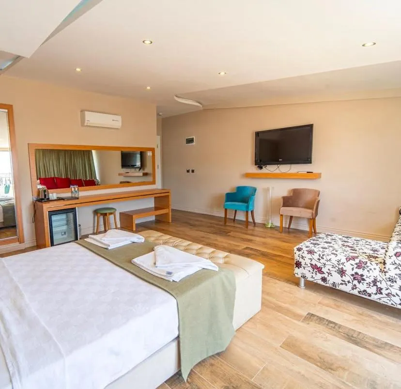 Bed in Aurasia Sea Side Hotel