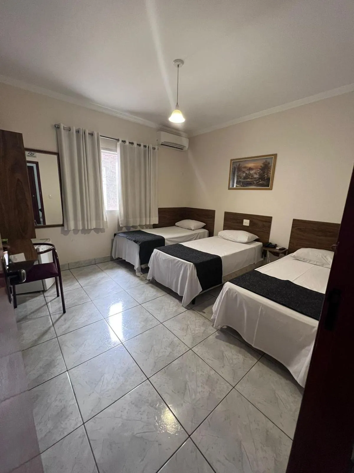 Bed in Rio Claro Plaza Hotel