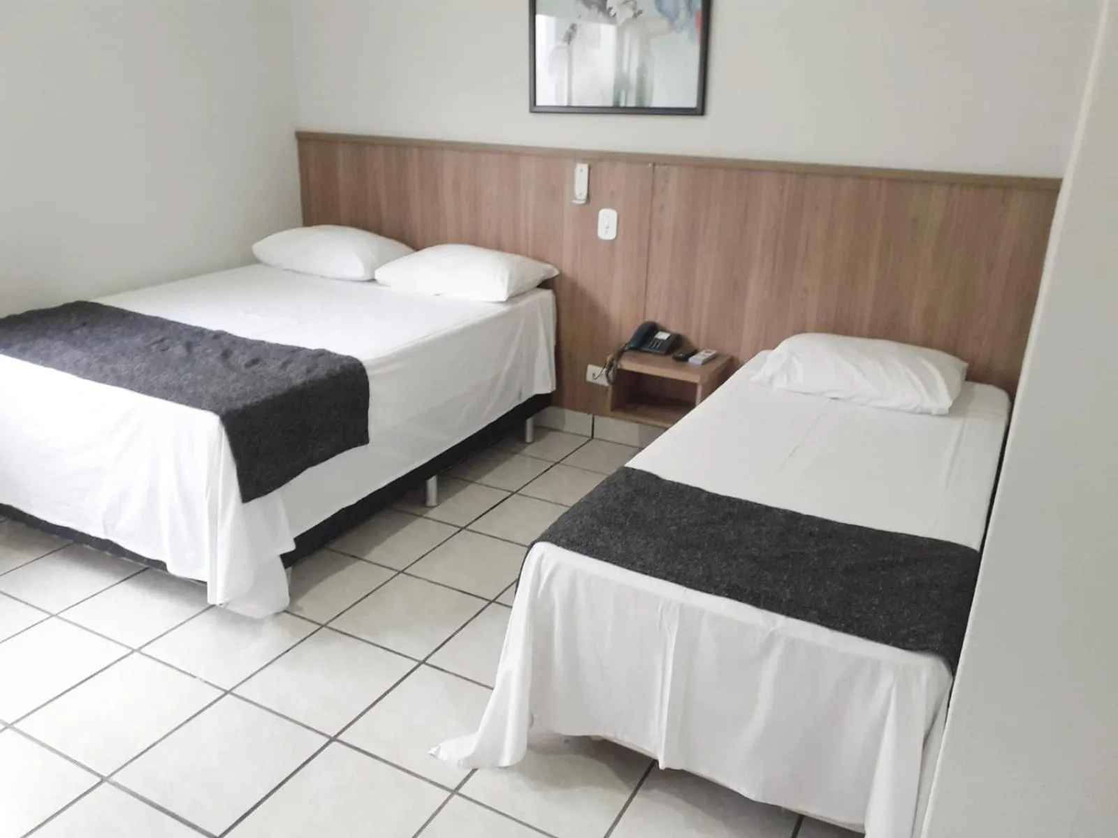 Bed in Rio Claro Plaza Hotel