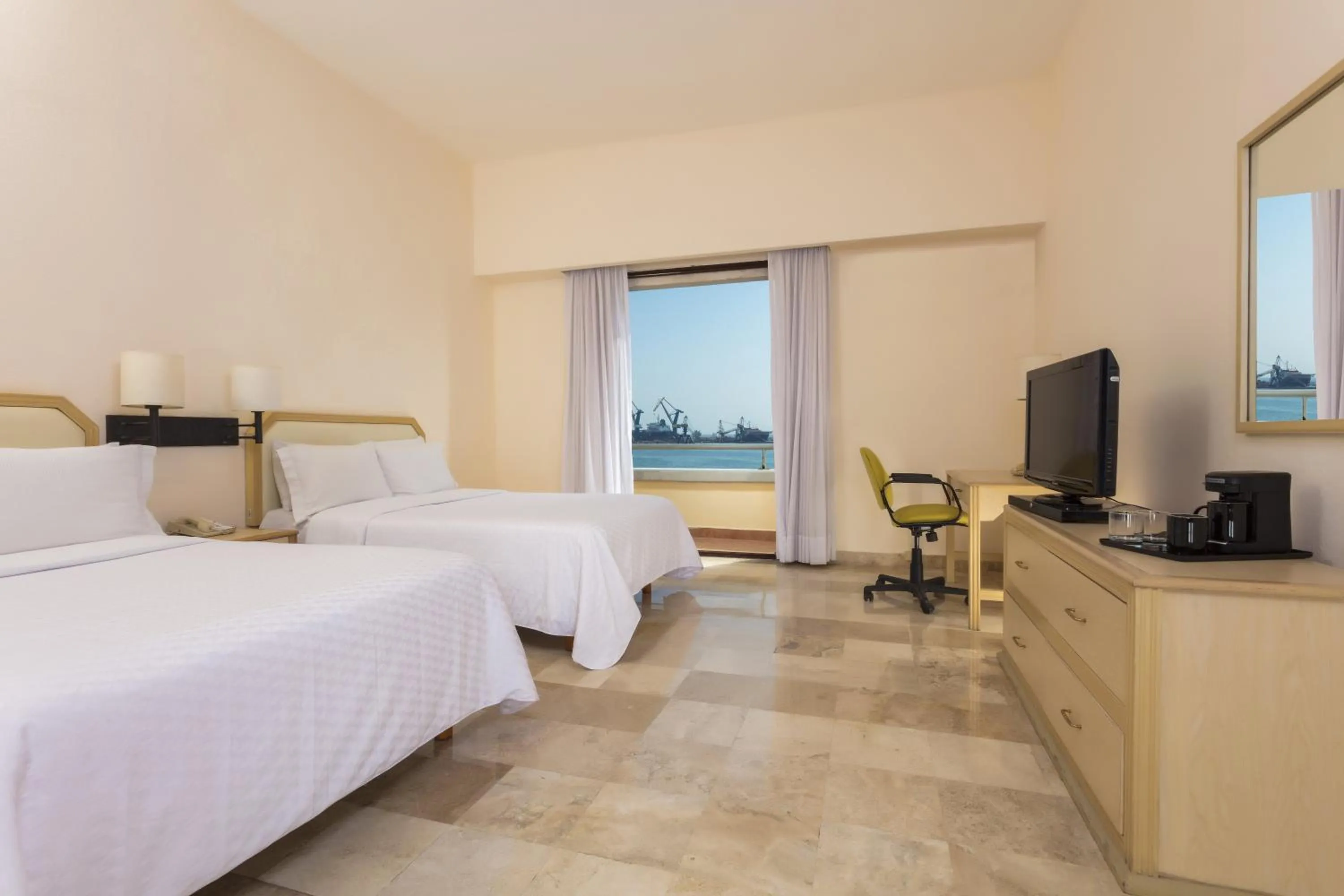 Photo of the whole room, Bed in Fiesta Inn Veracruz Malecon