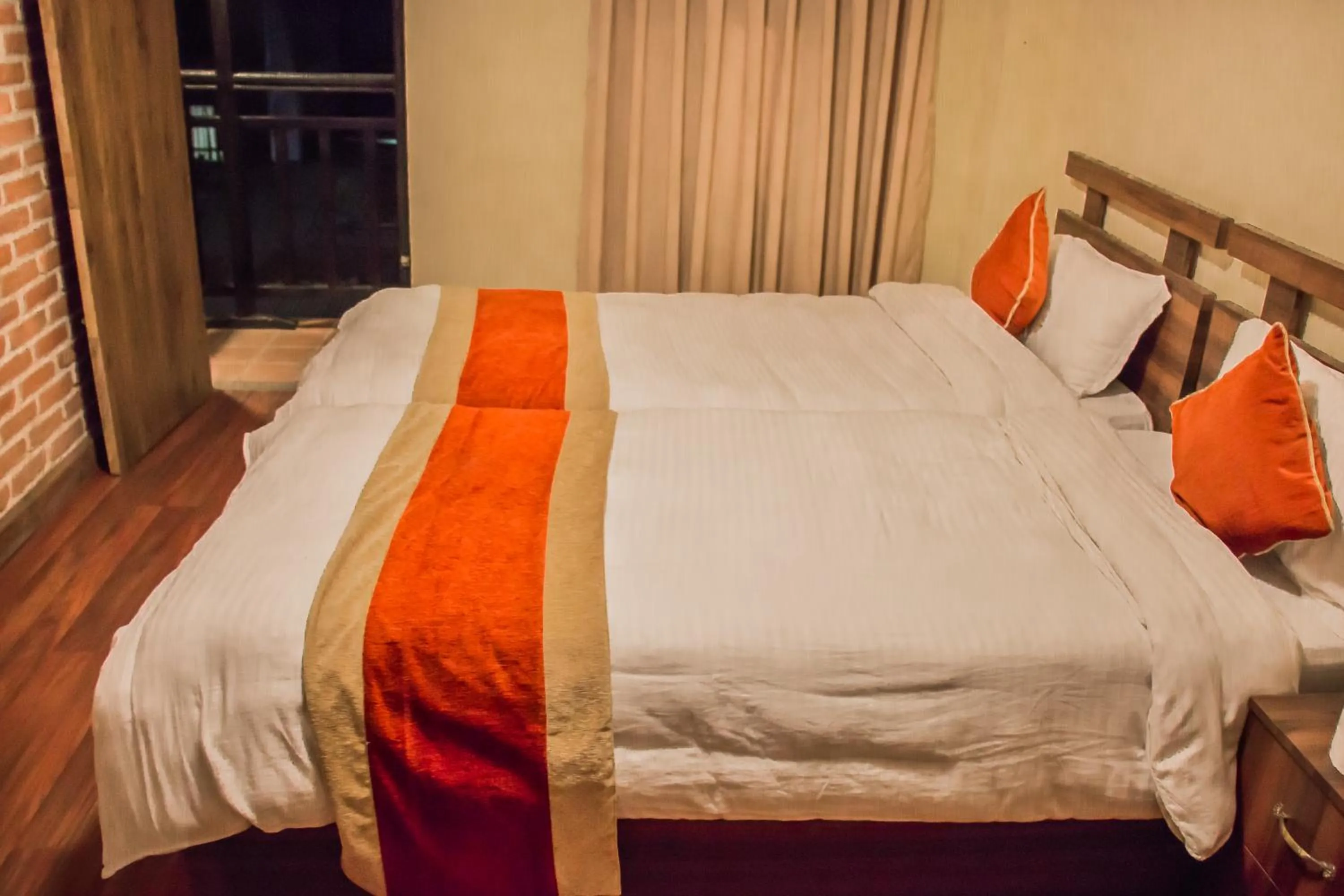Bed in HOTEL LAYAKU DURBAR