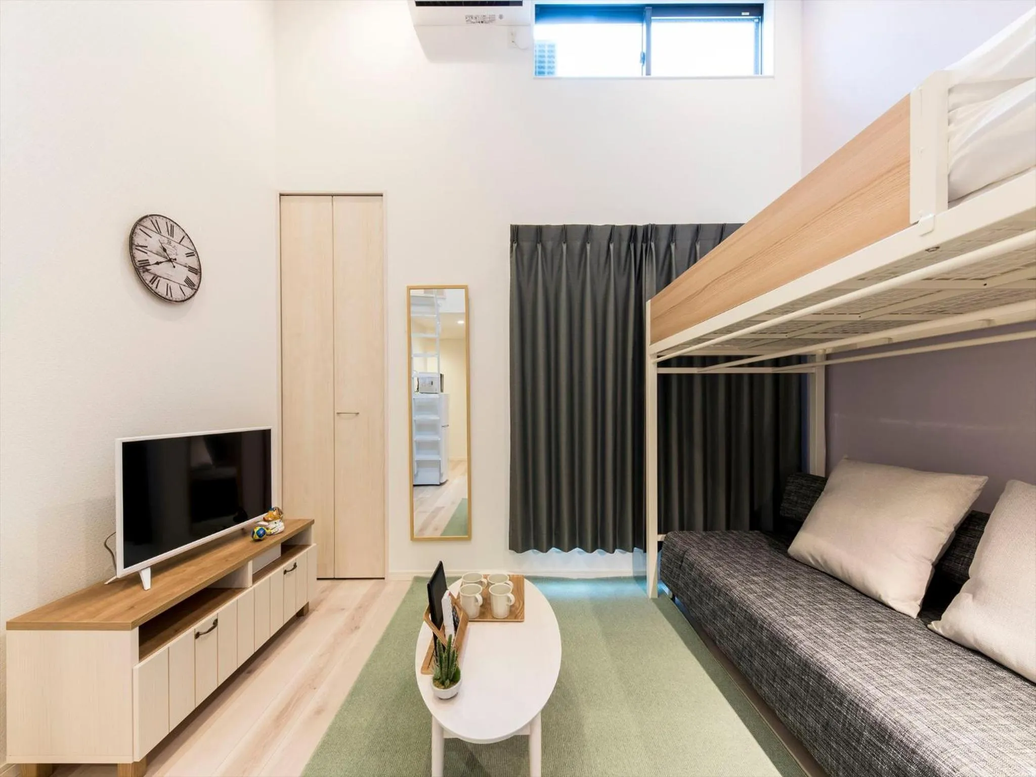 Living room, Bed in TRIP POD SUMIYOSHI B