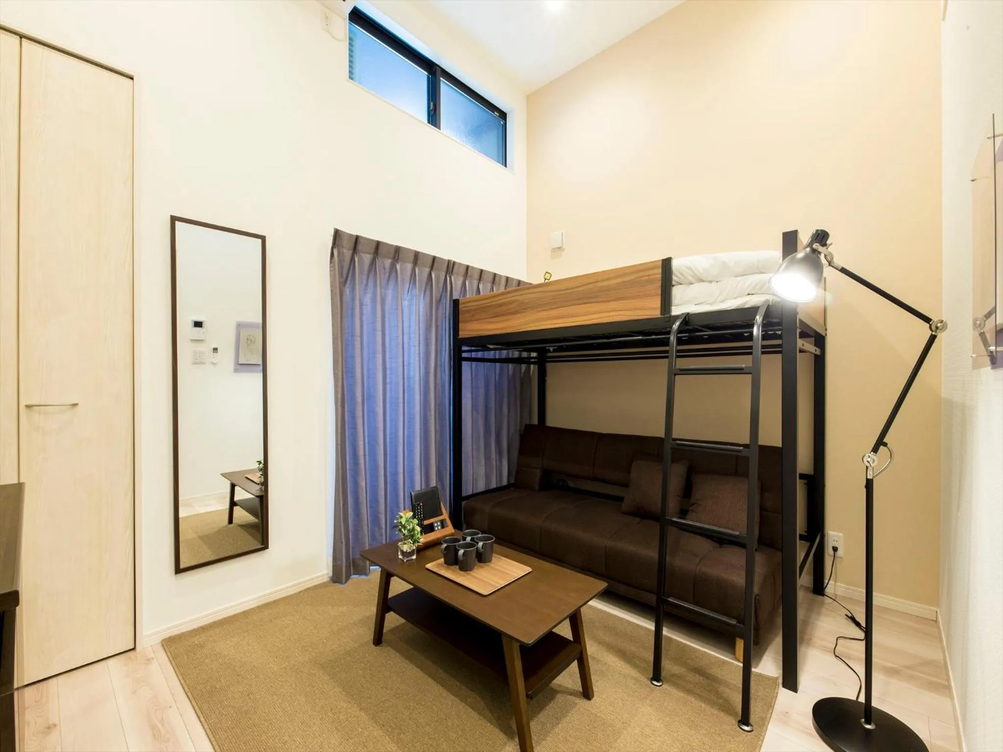Living room, Bed in TRIP POD SUMIYOSHI B
