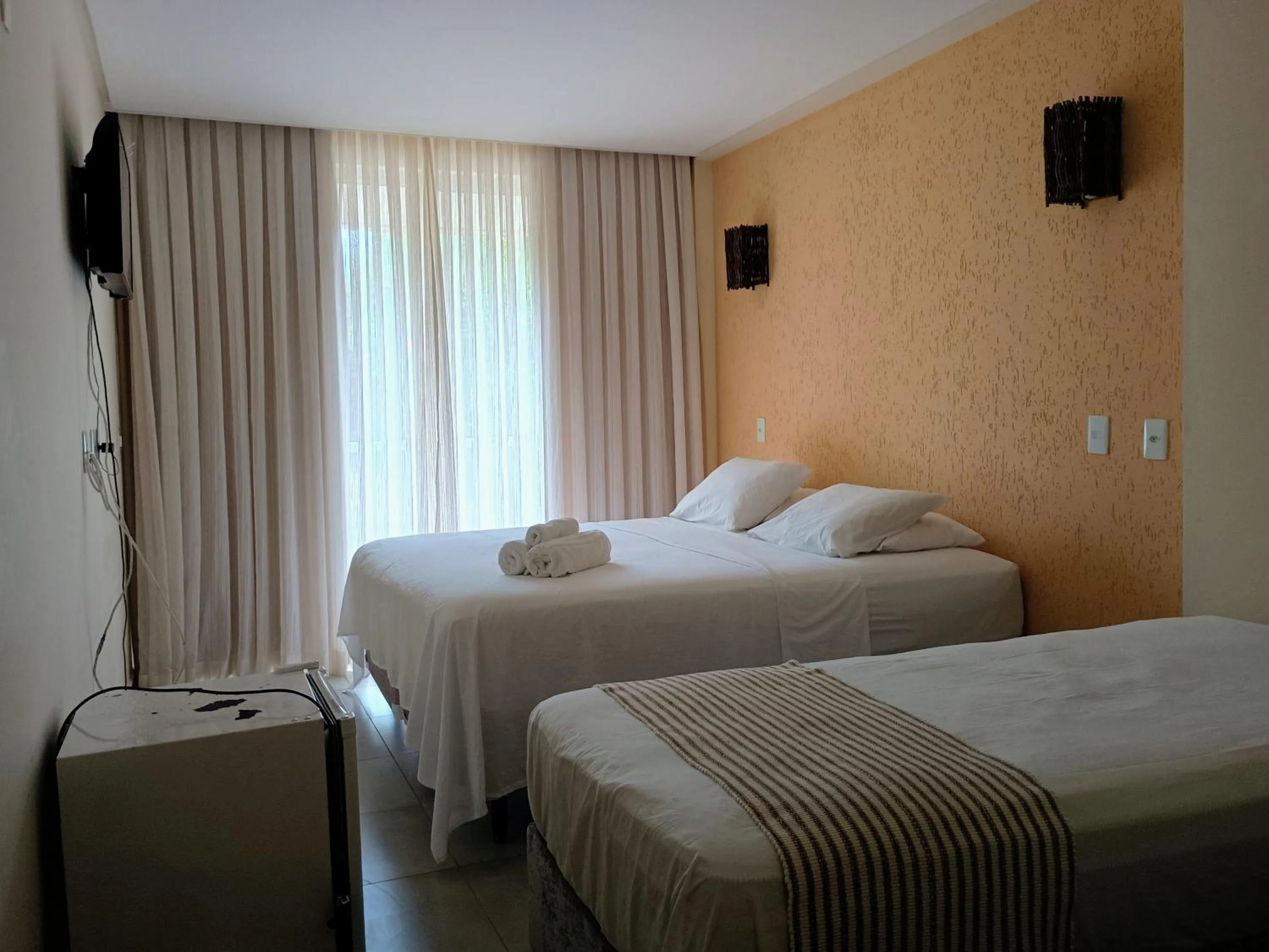 Photo of the whole room, Bed in Pousada Laguna