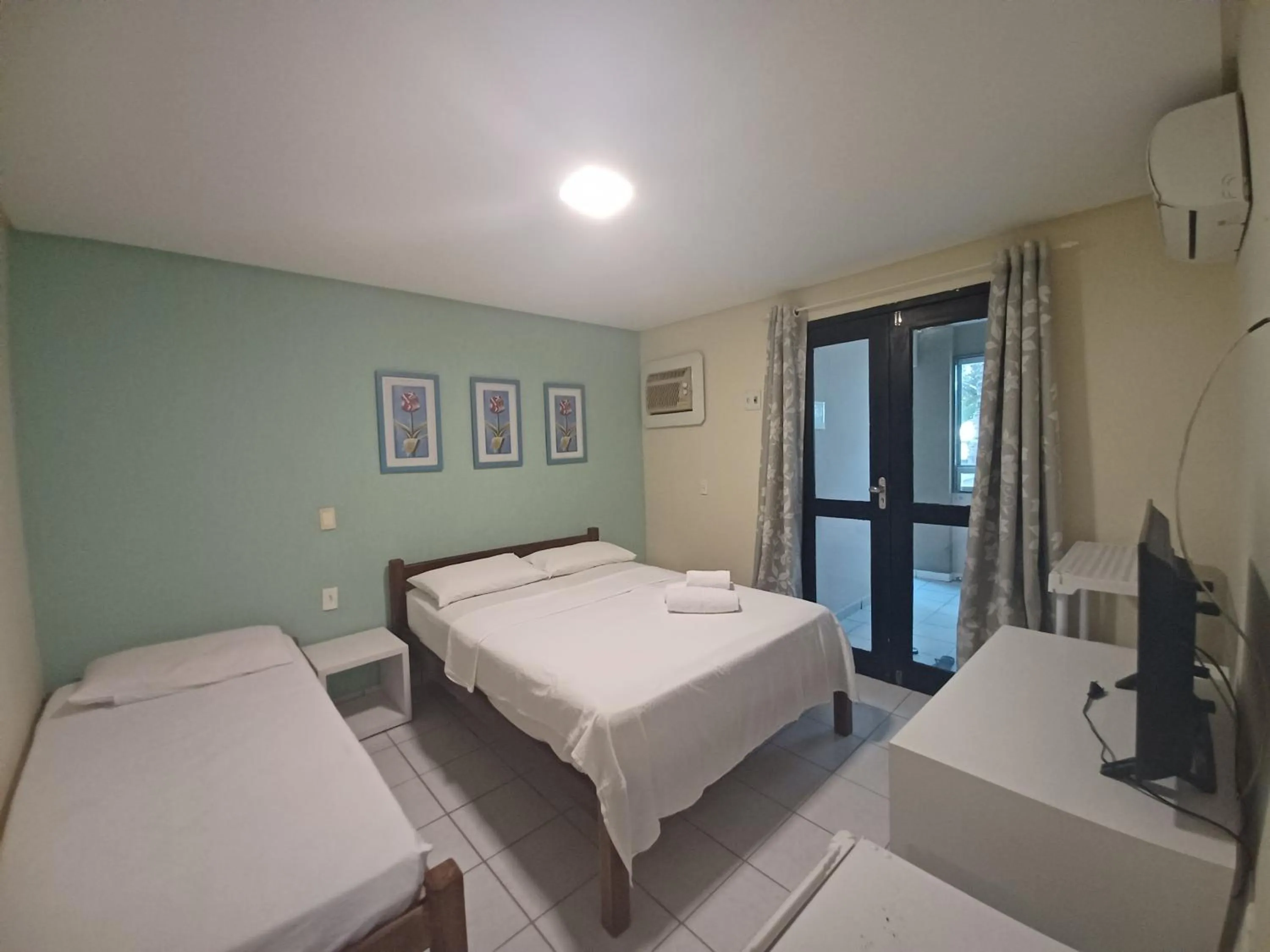 Bed in Pousada Laguna