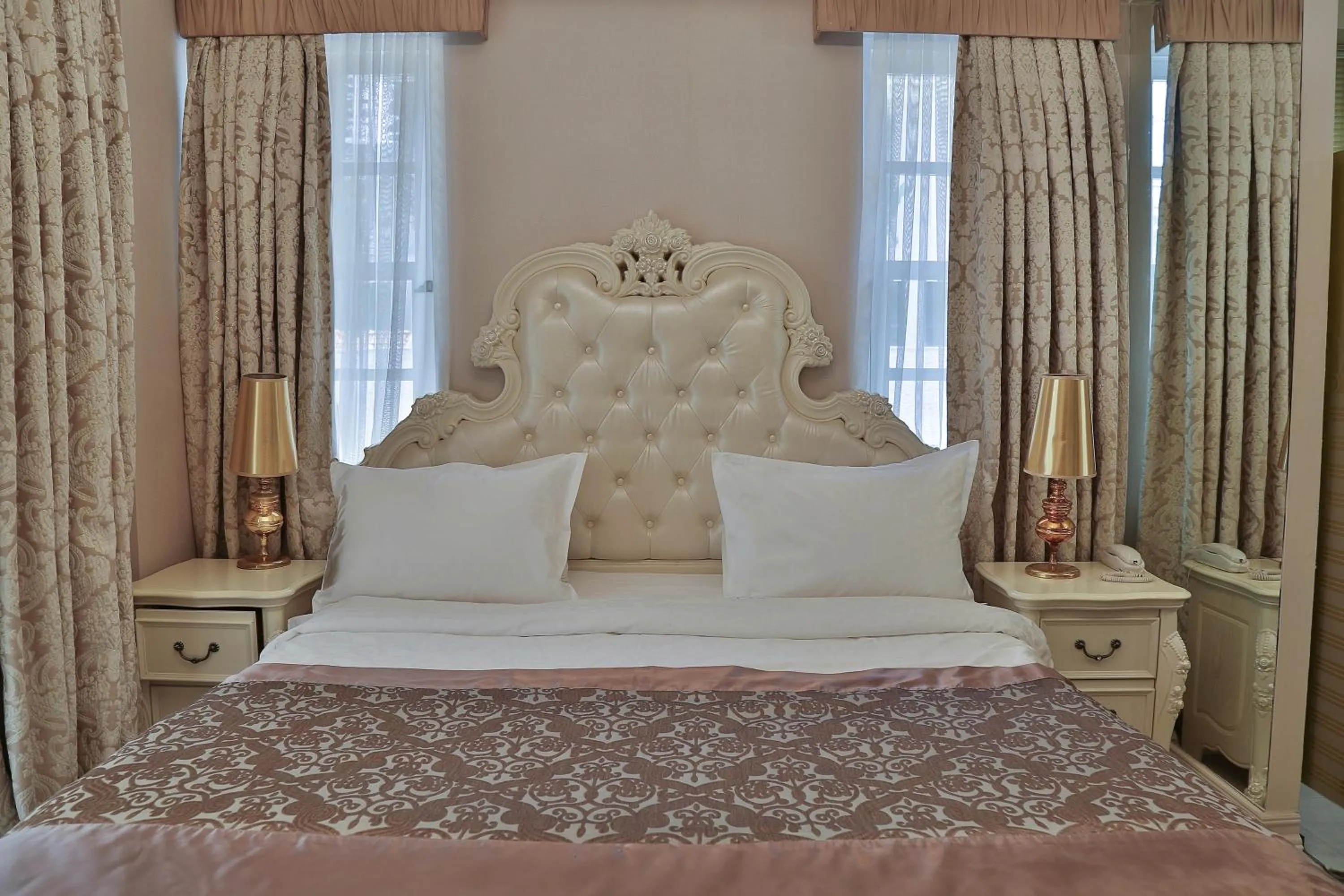 Bed in Elegance East Hotel