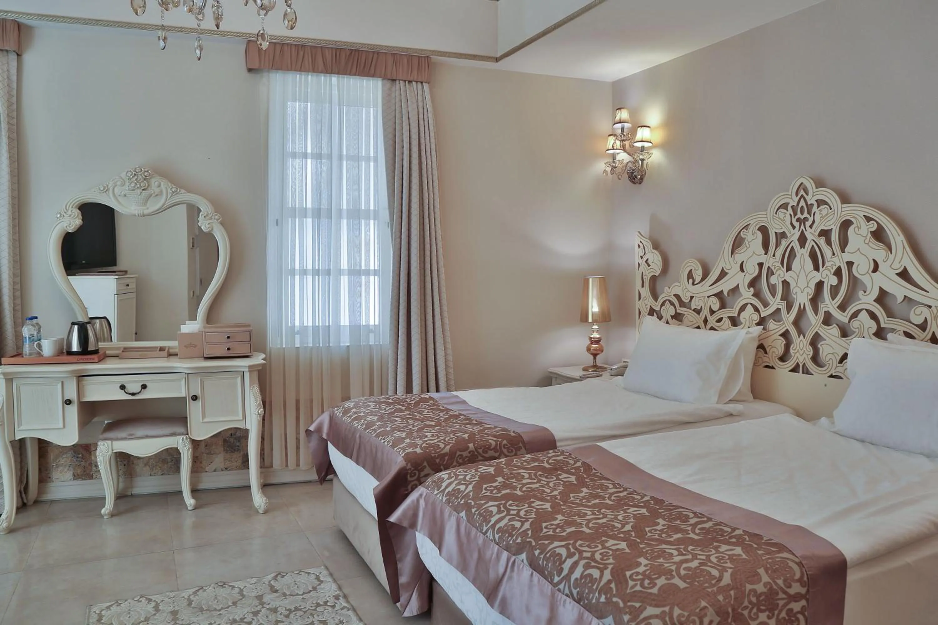 Bed in Elegance East Hotel