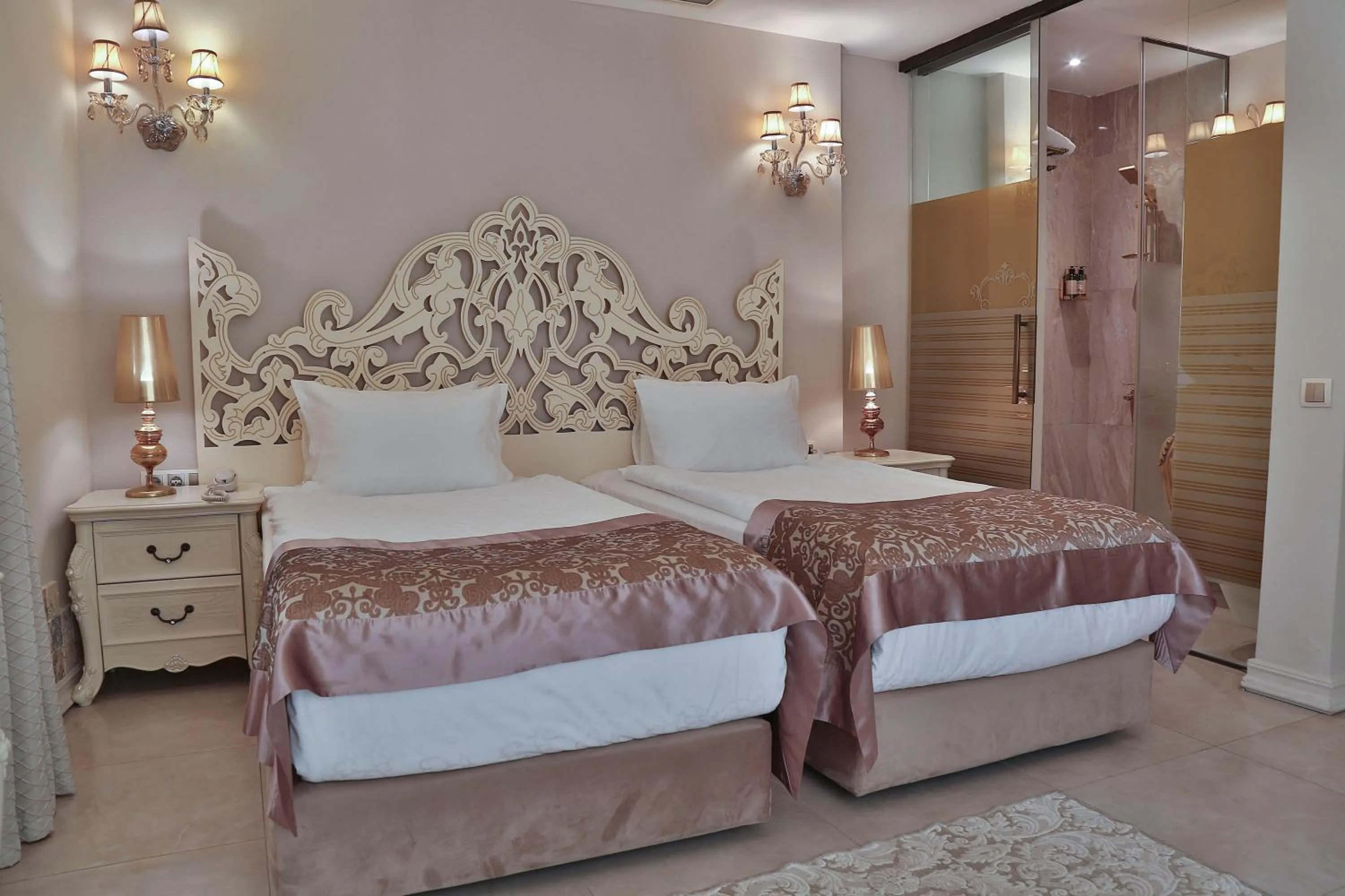 Bed in Elegance East Hotel