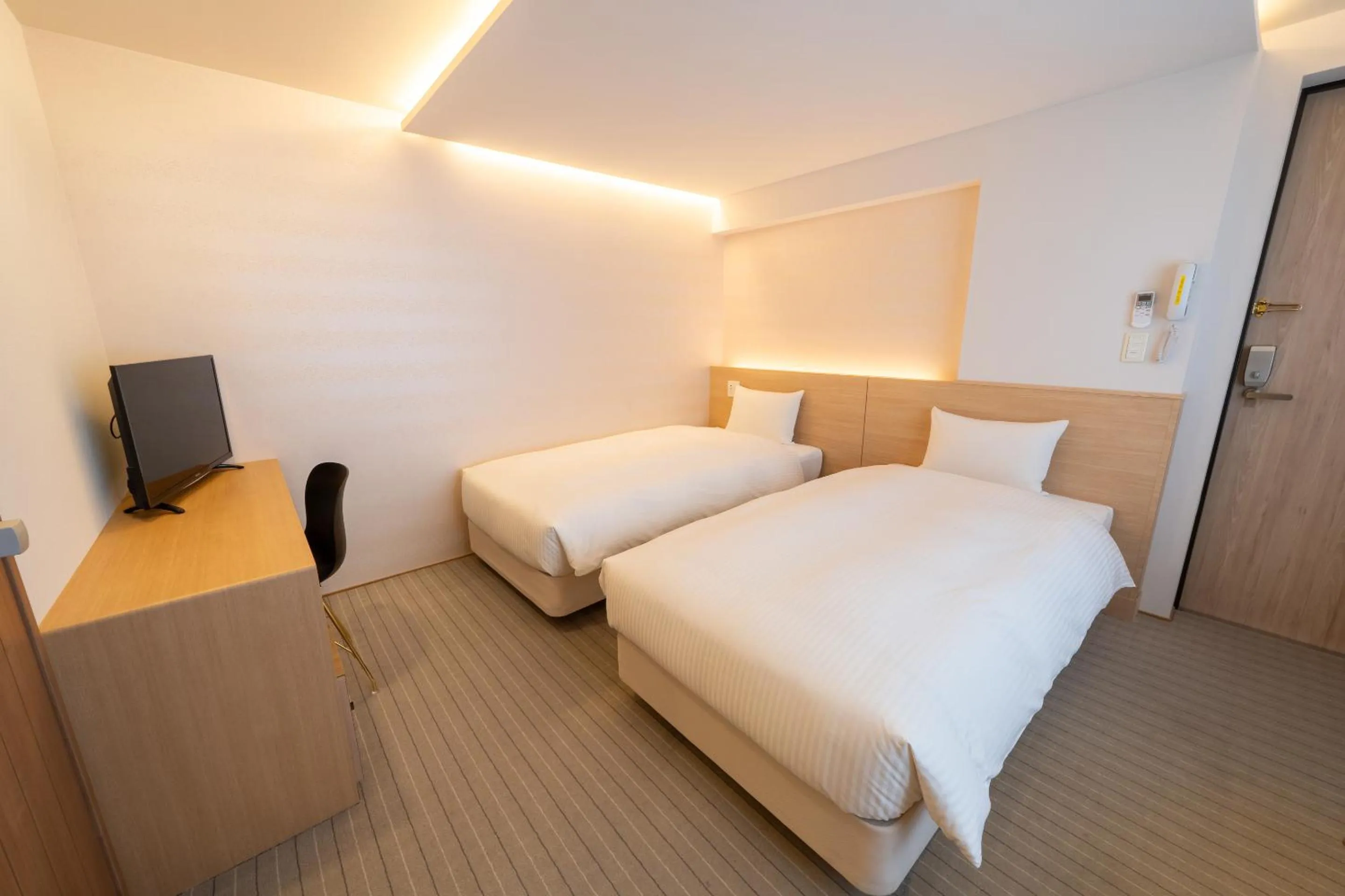 Bed in RESI STAY Hachi Inn