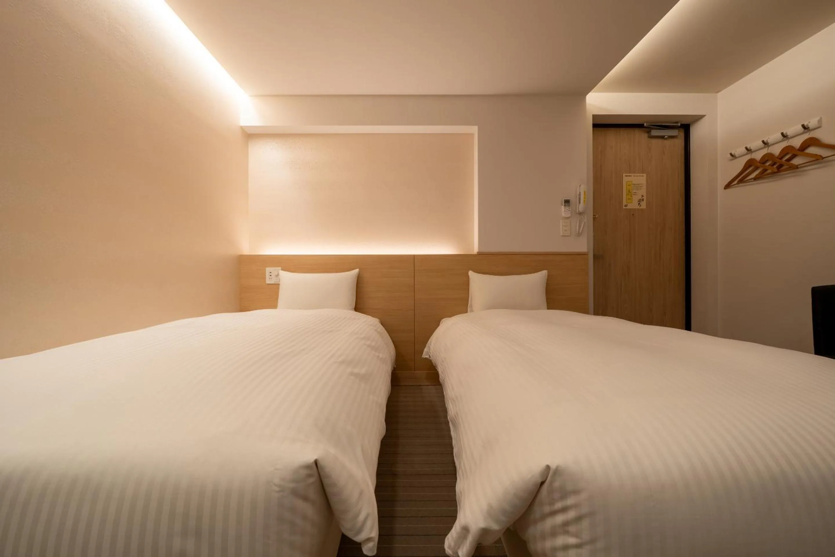 Bed in RESI STAY Hachi Inn