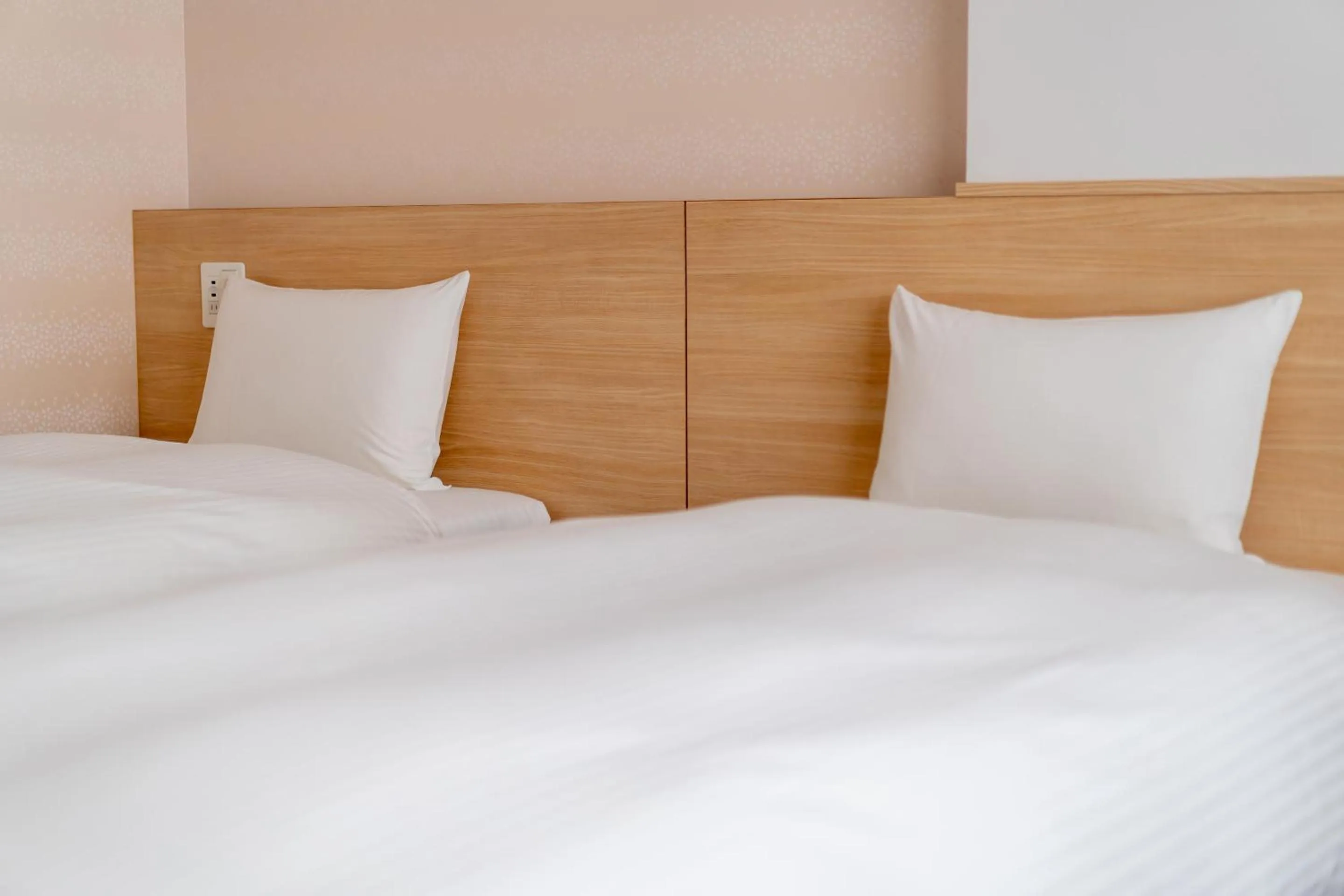 Bed in RESI STAY Hachi Inn