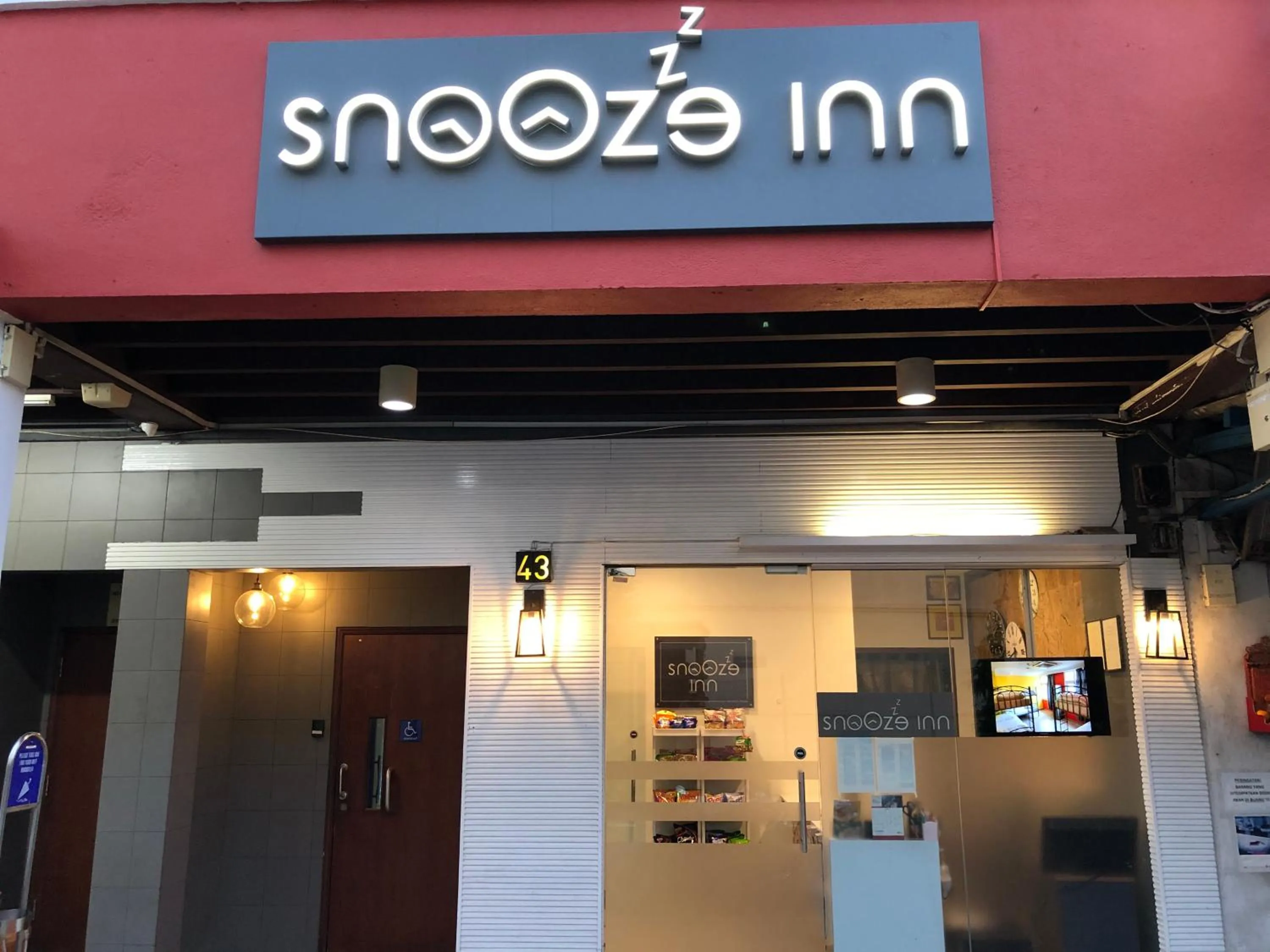 Property logo or sign in Snooze Inn @Dickson Road