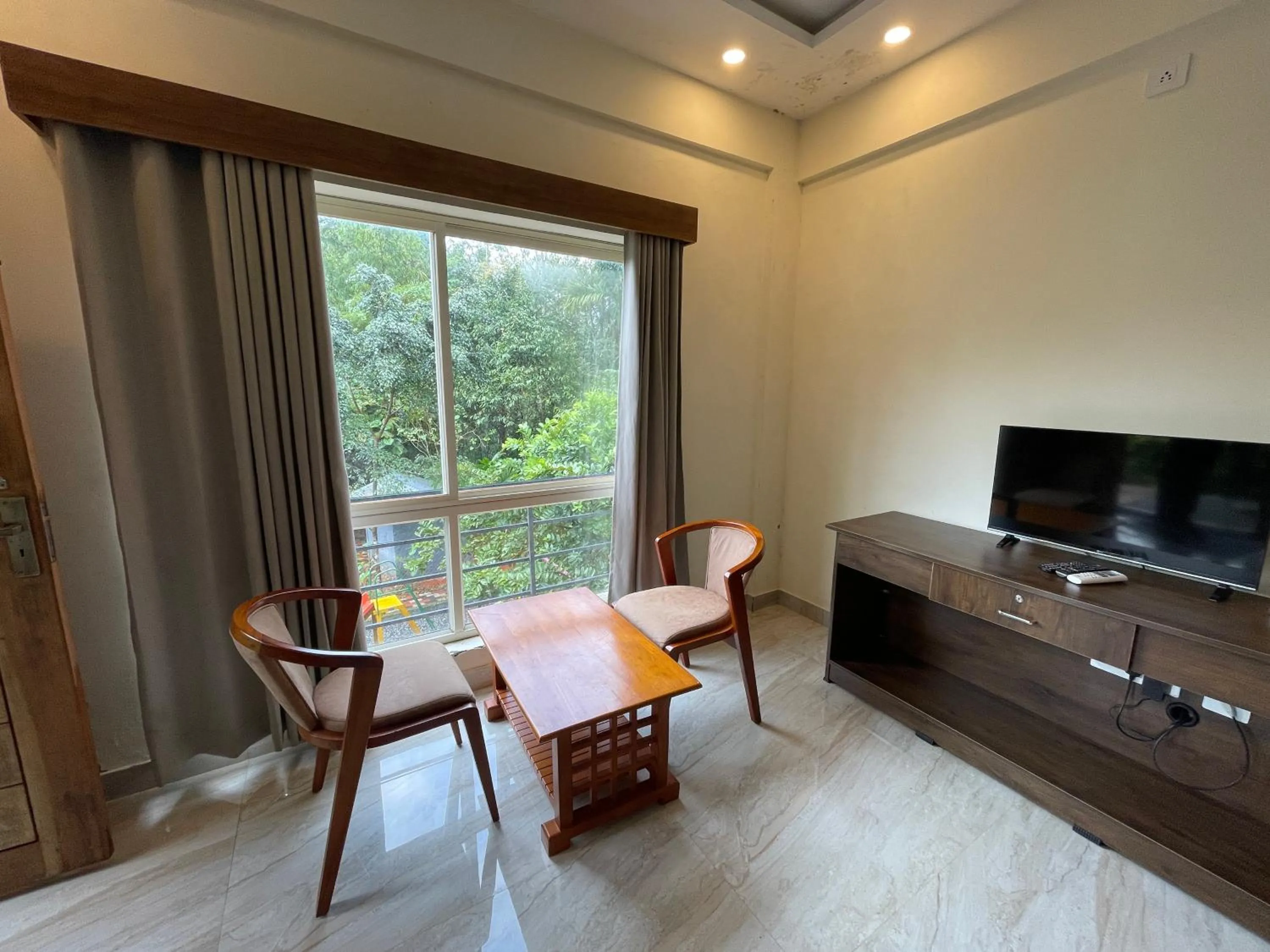 TV and multimedia in Le Eden Premium Wayanad Pool Resort
